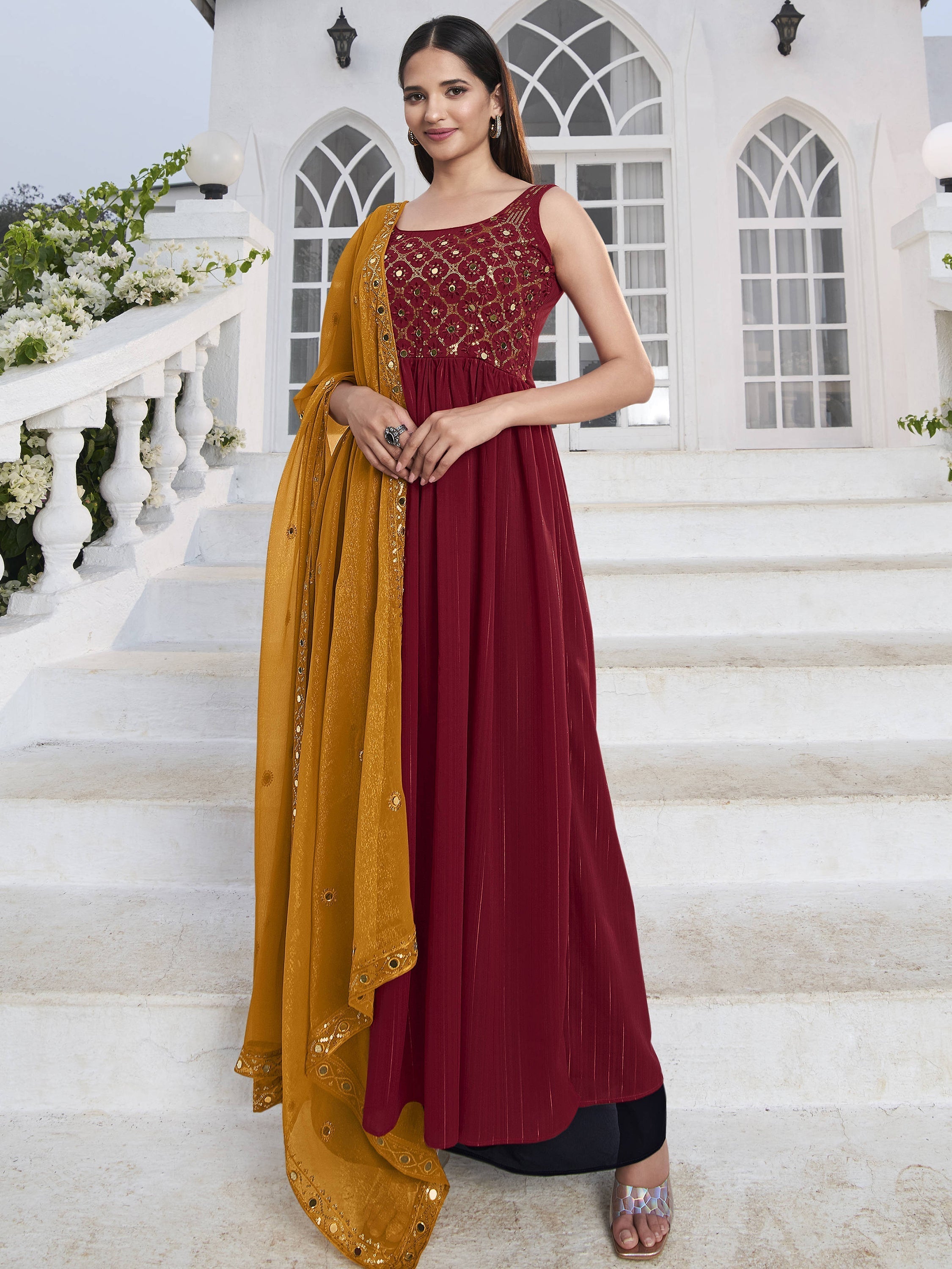 Red georgette suit with sequins and thread embroidery on the bodice
