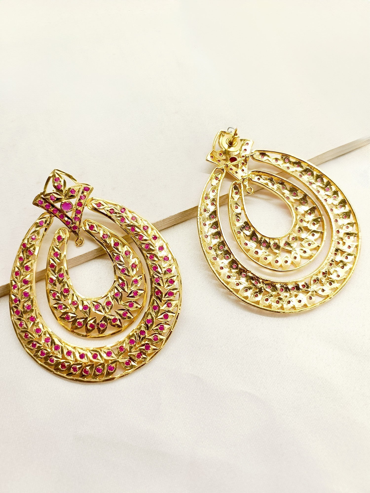 Elegant traditional Jadau earrings with intricate craftsmanship
