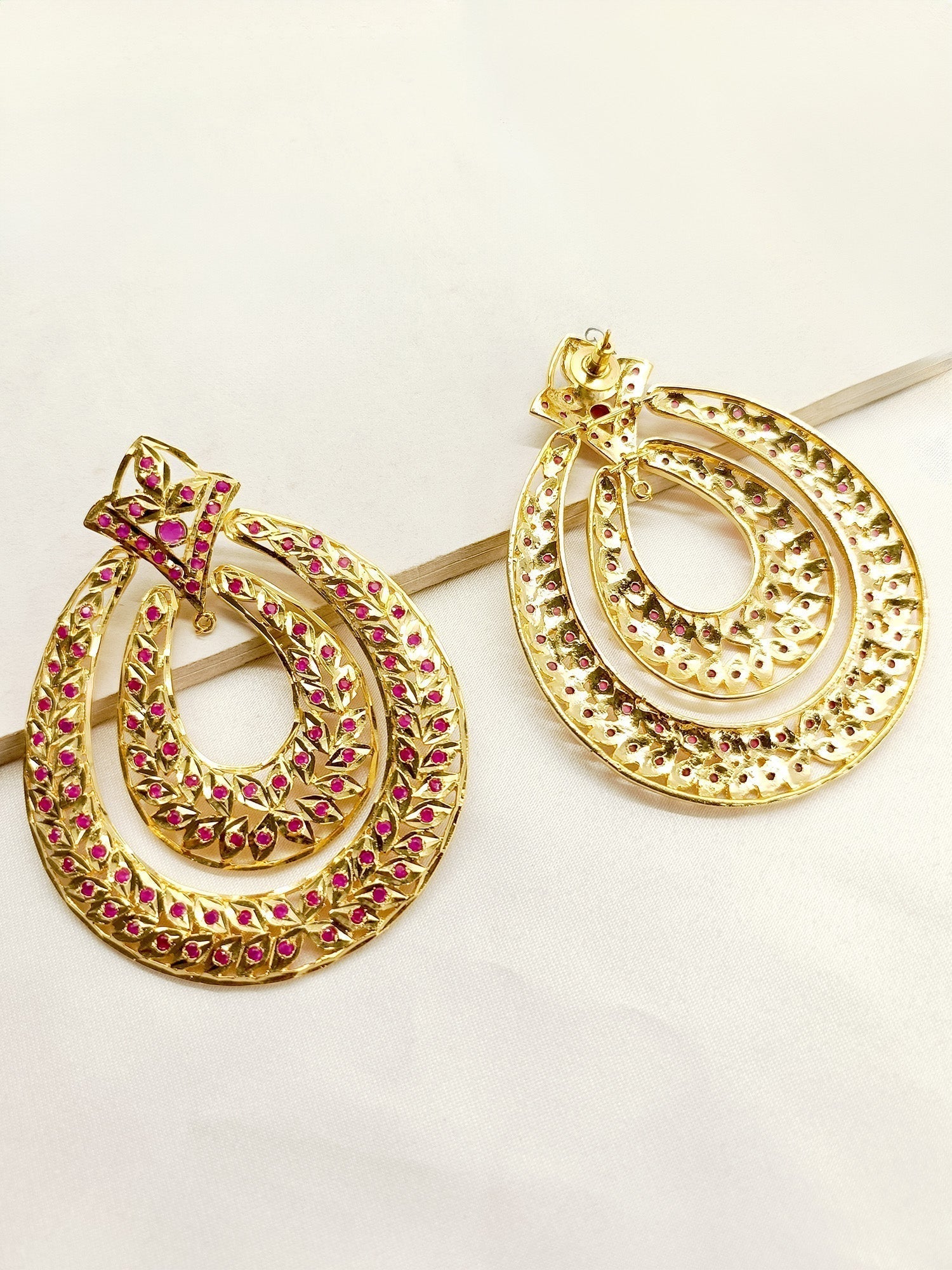 Elegant traditional Jadau earrings with intricate craftsmanship