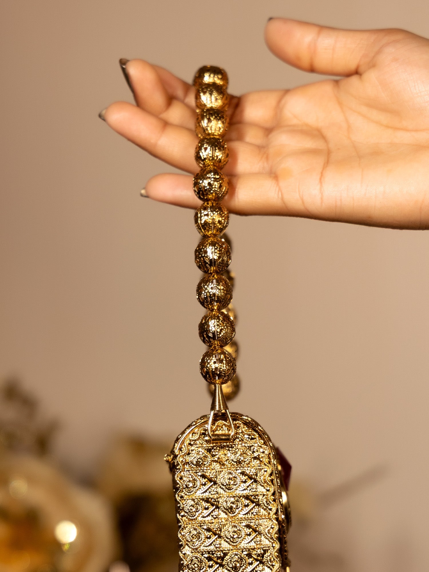 Kiran Ruby Golden Mobile Pouch - qivii