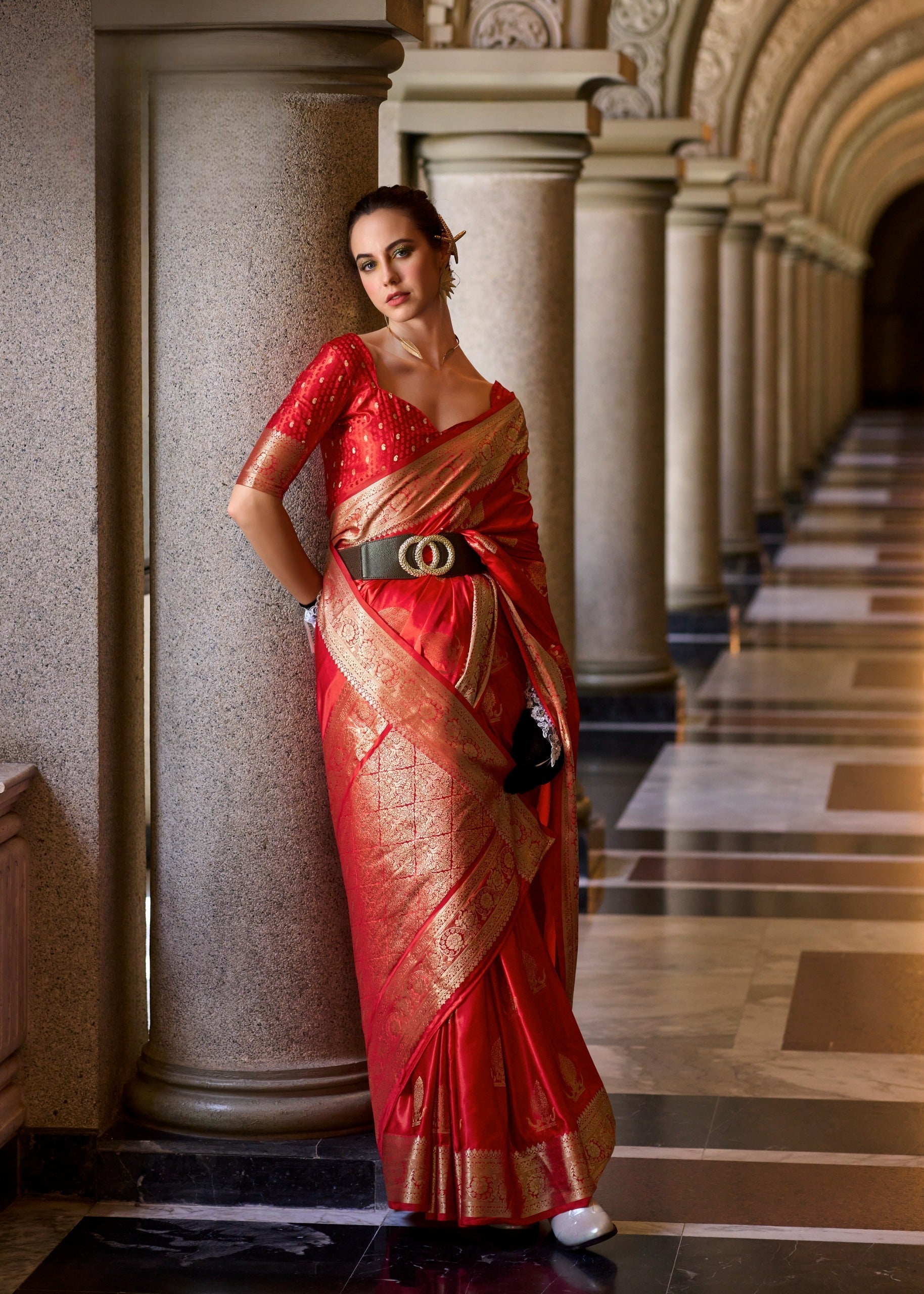 Close-up of intricately woven Zari border on Red Satin Mungha Silk Saree