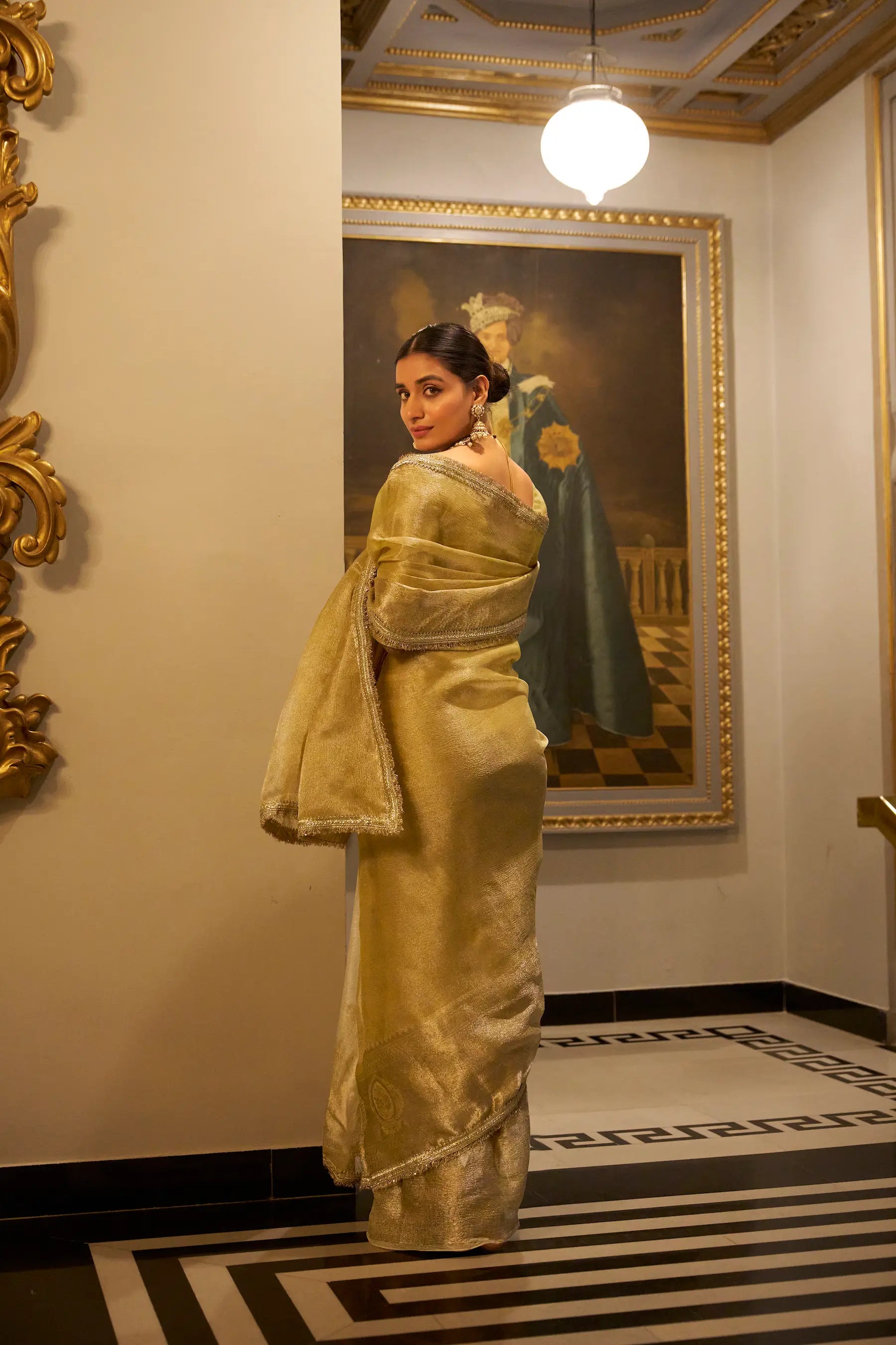 Golden Shimmer Tissue Saree With Zari Weaving Work & Sequins Lace Border
