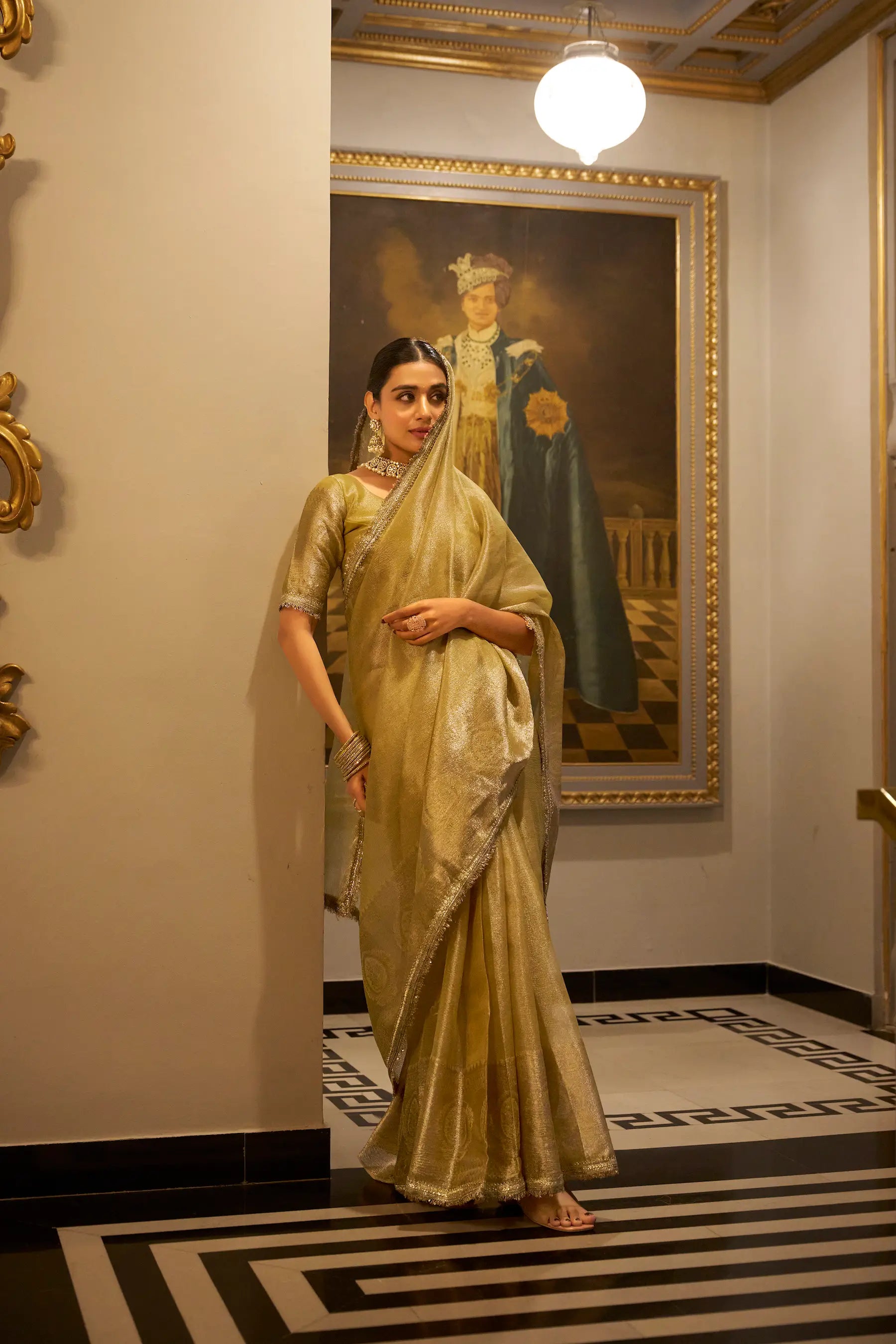 Golden Shimmer Tissue Saree With Zari Weaving Work & Sequins Lace Border