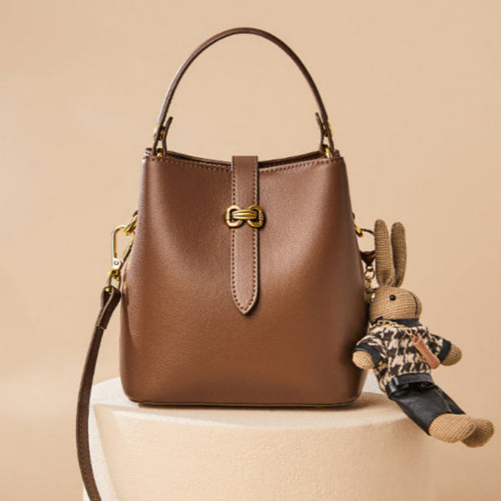 Women’s Bunny Charm Bucket Satchel — Cowhide Leather Convertible with Sculptural Clasp & Signature Whimsy