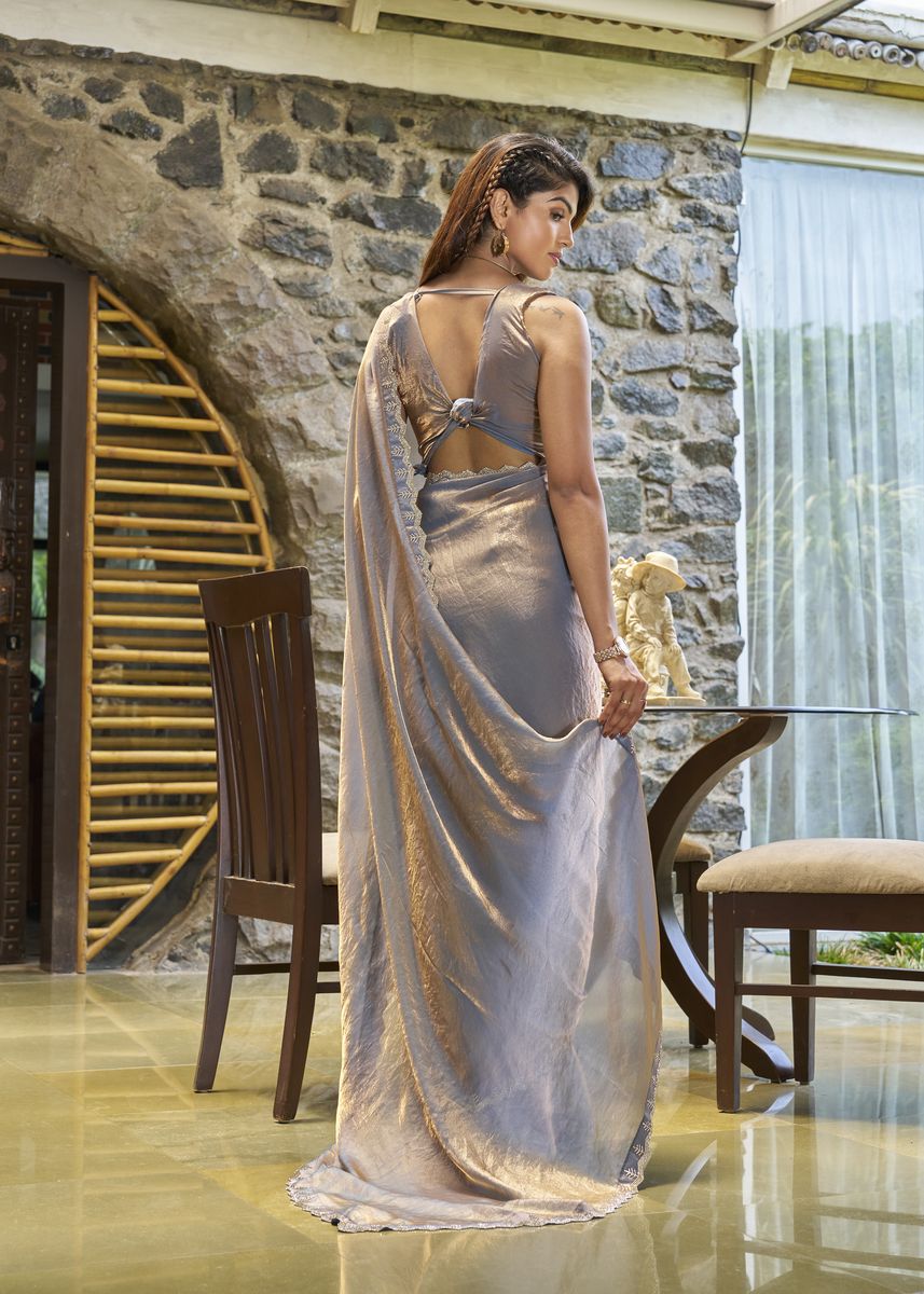 Grey satin silk saree with intricate handwork and zarkan embroidery