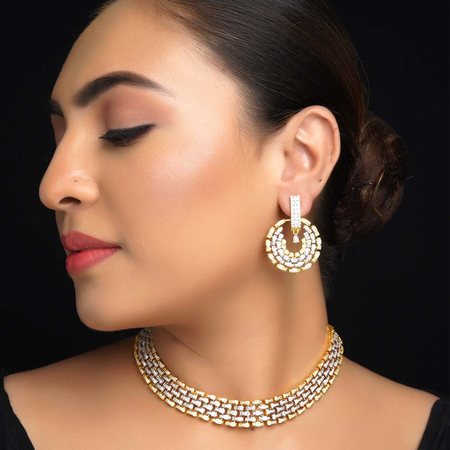 Gold-plated necklace set with American diamond on brass metal