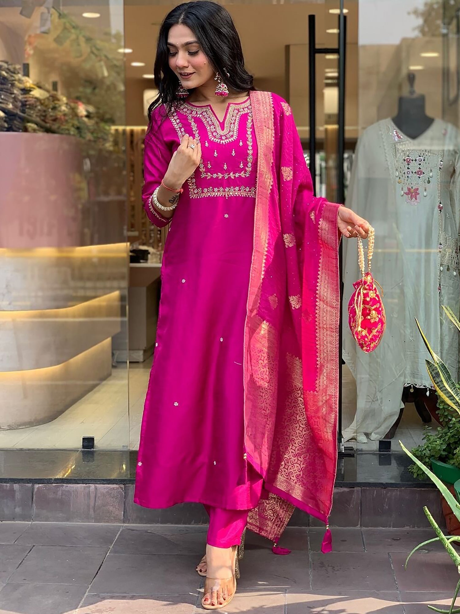 Regal rani pink pantsuit with intricate zari work and sequin detailing