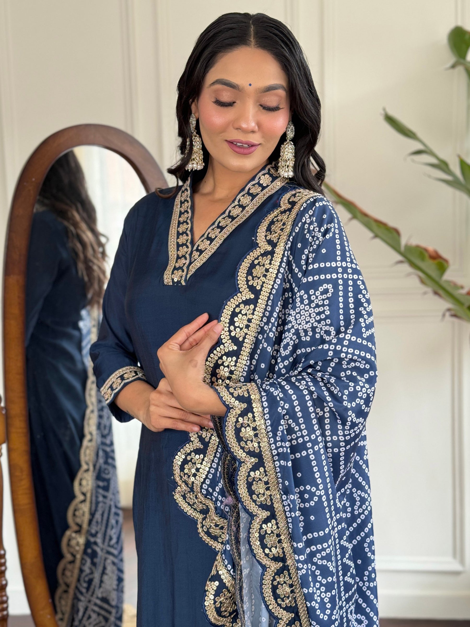 Silk dupatta with intricate bandhani print work, thread embroidery, sequin details, and lace border