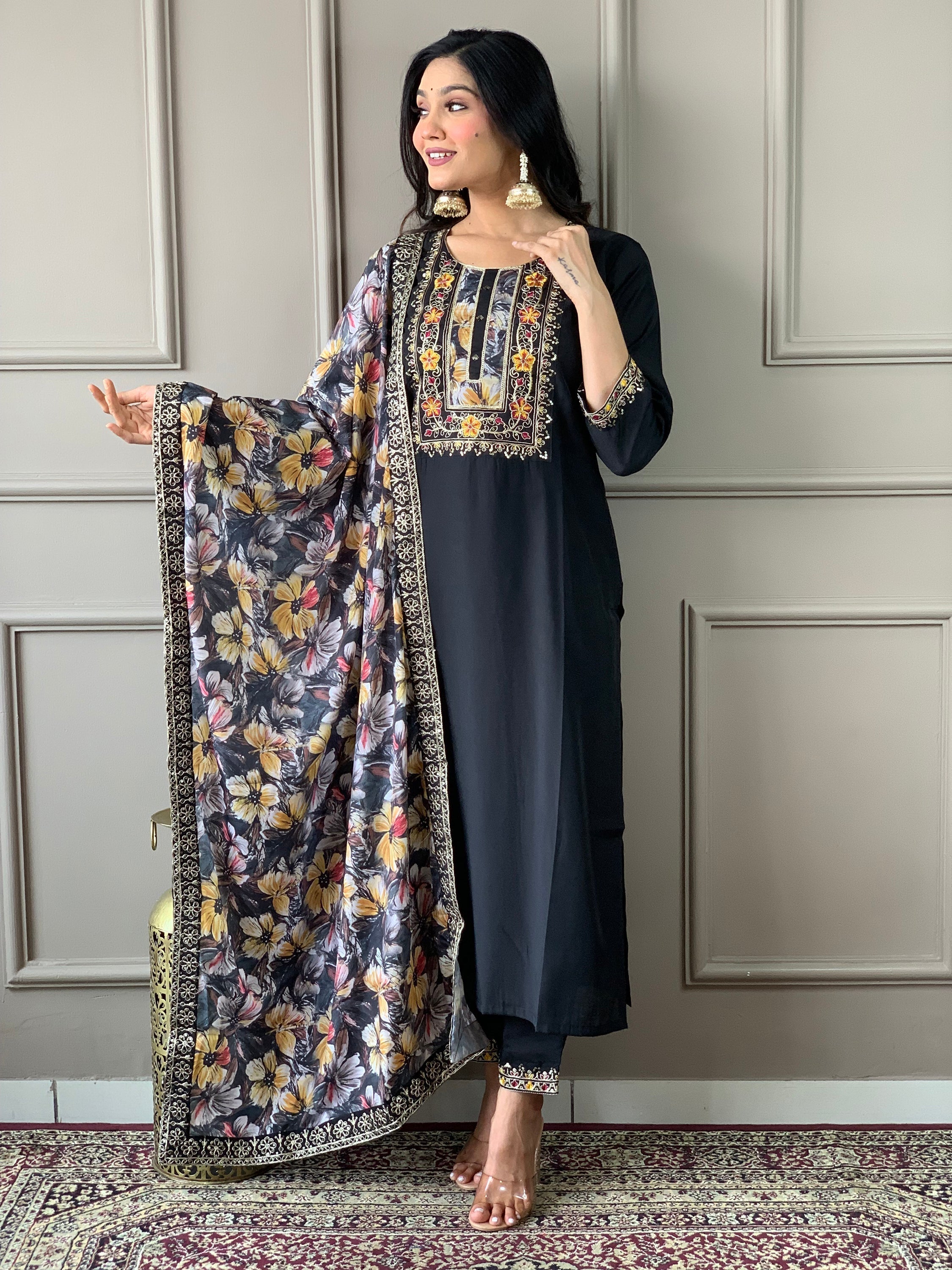 Matching Chanderi silk pants and a similarly crafted dupatta with intricate floral print and a beautiful lace border