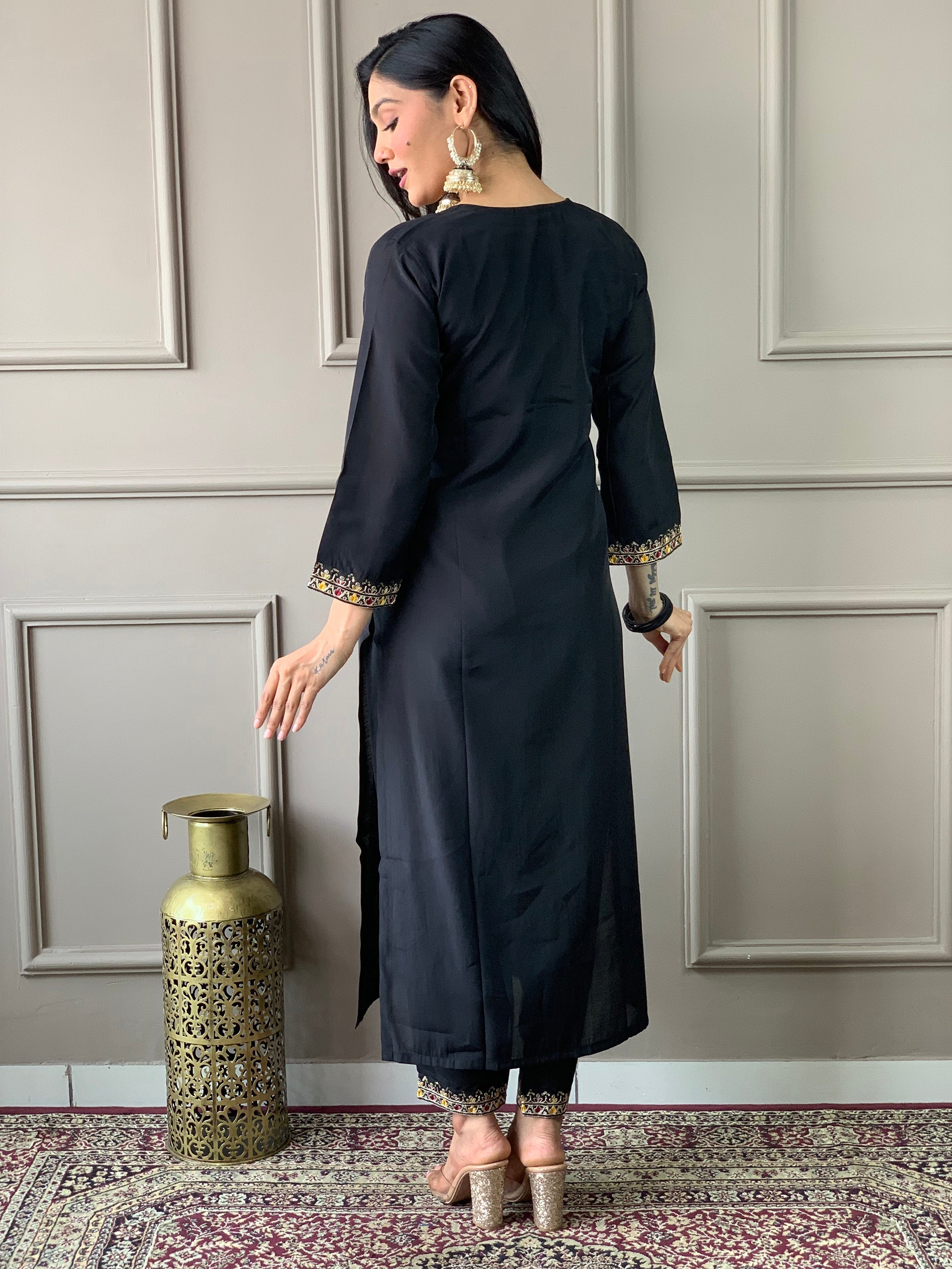Fully stitched black pant suit available in sizes XS to XXL, offering both comfort and style