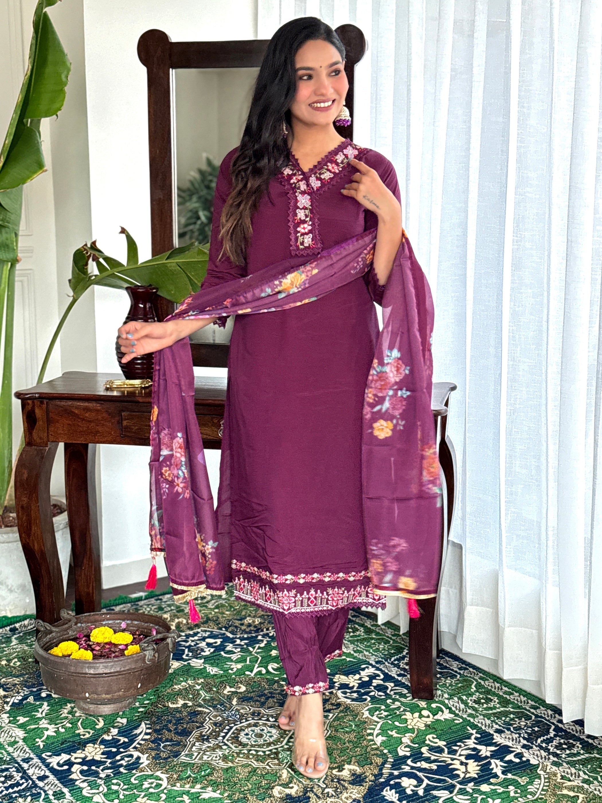 Matching burgundy organza dupatta adorned with delicate print work
