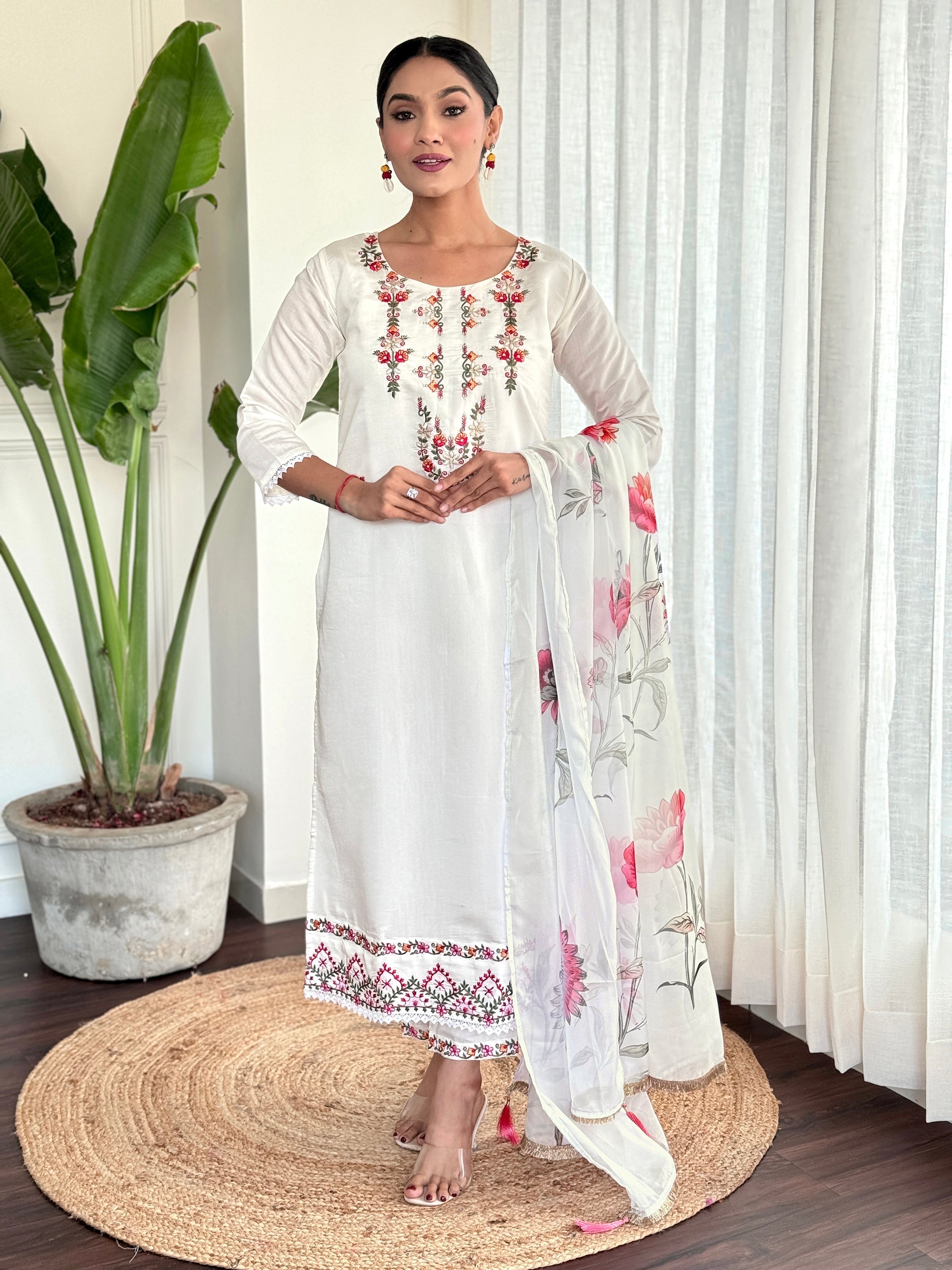 Exquisite white chanderi silk suit with intricate embroidered work