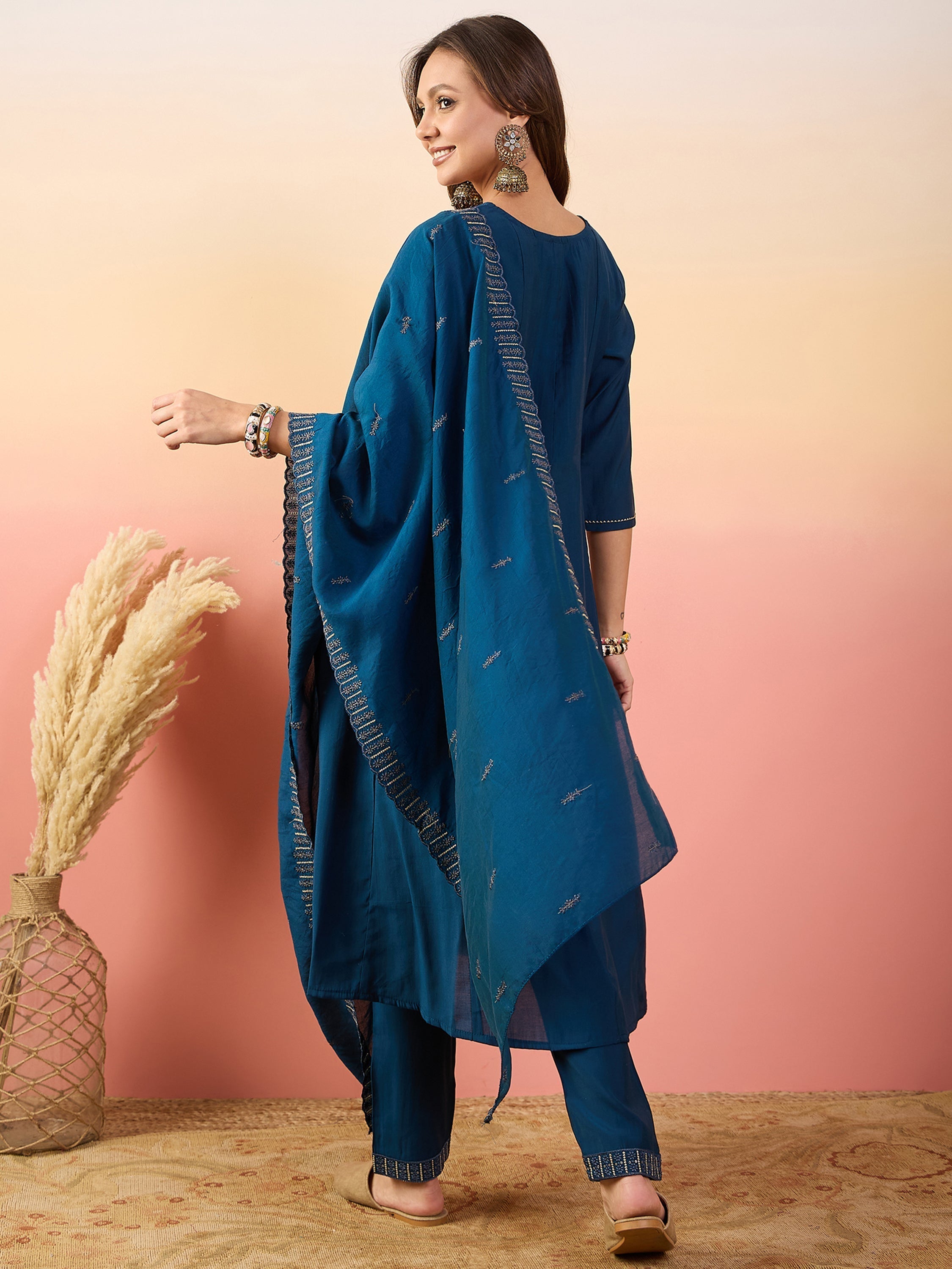 Embroidered lace border on similar color silk pants for a traditional yet modern look