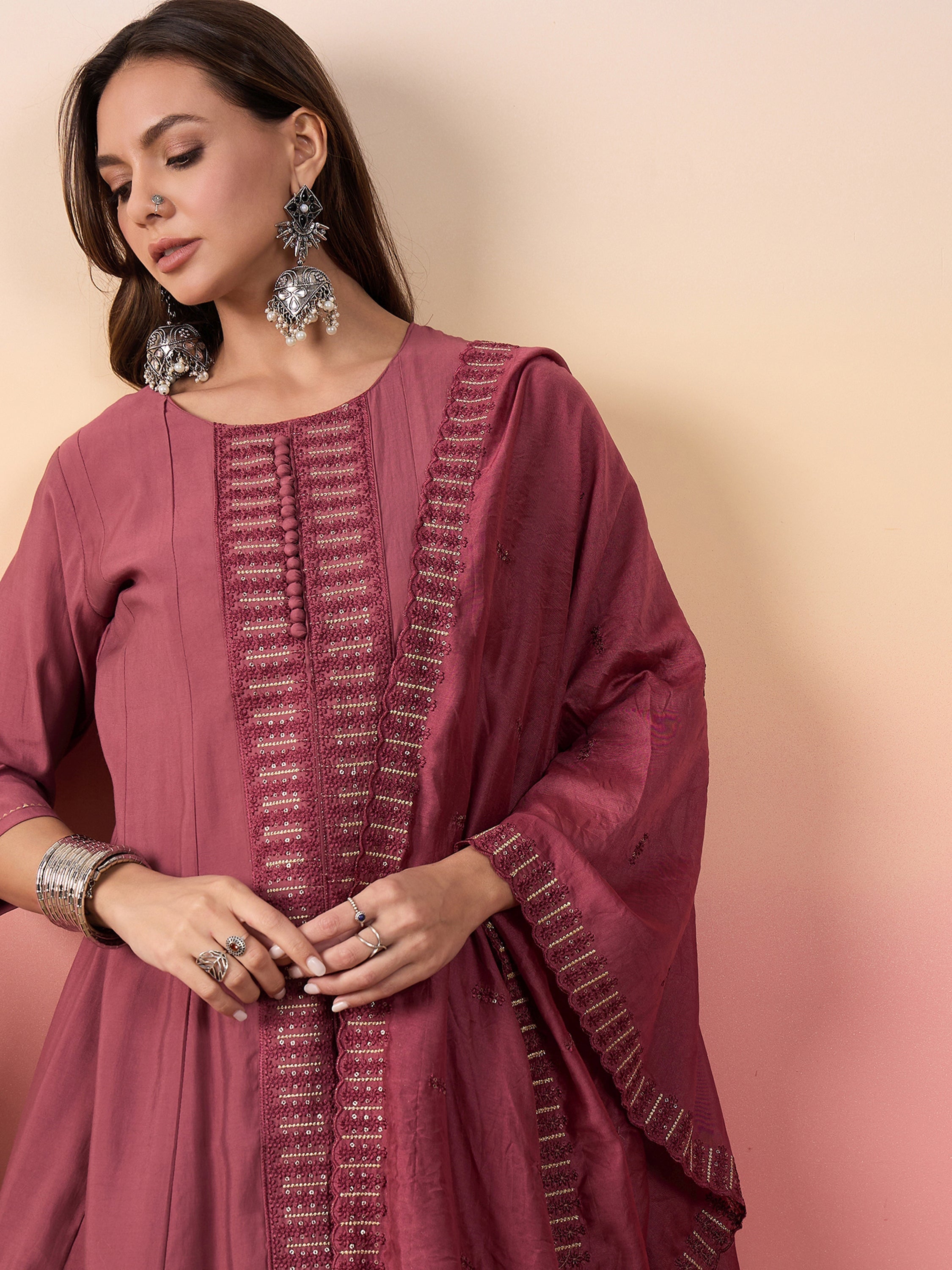 Pink silk pants with embroidered lace borderwork