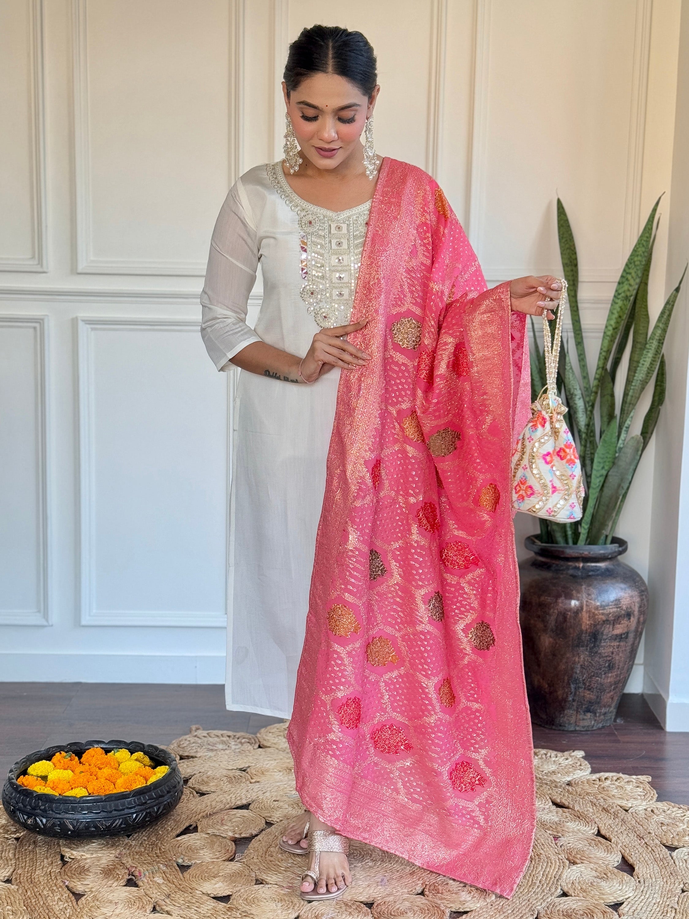 Beautiful off-white embroidered Chanderi traditional pant suit with intricate detailing