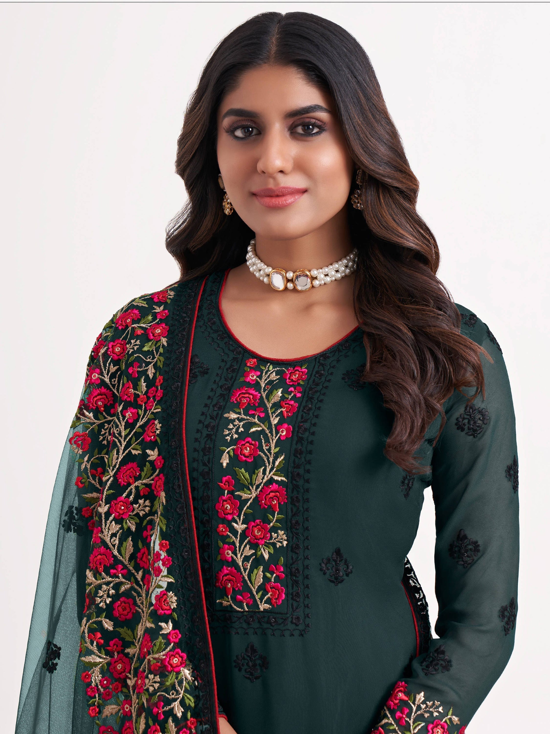 Dull santoon inner material green salwar suit with sequins and butti embroidery