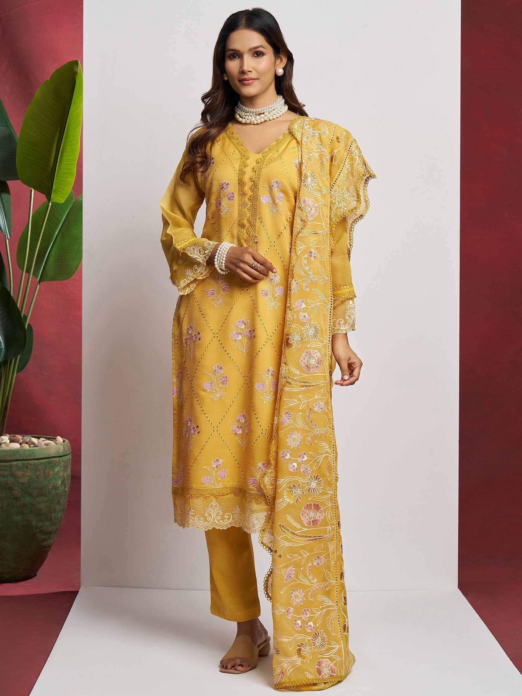 Exquisite yellow organza fabric suit with intricate floral embroidery and sequin work