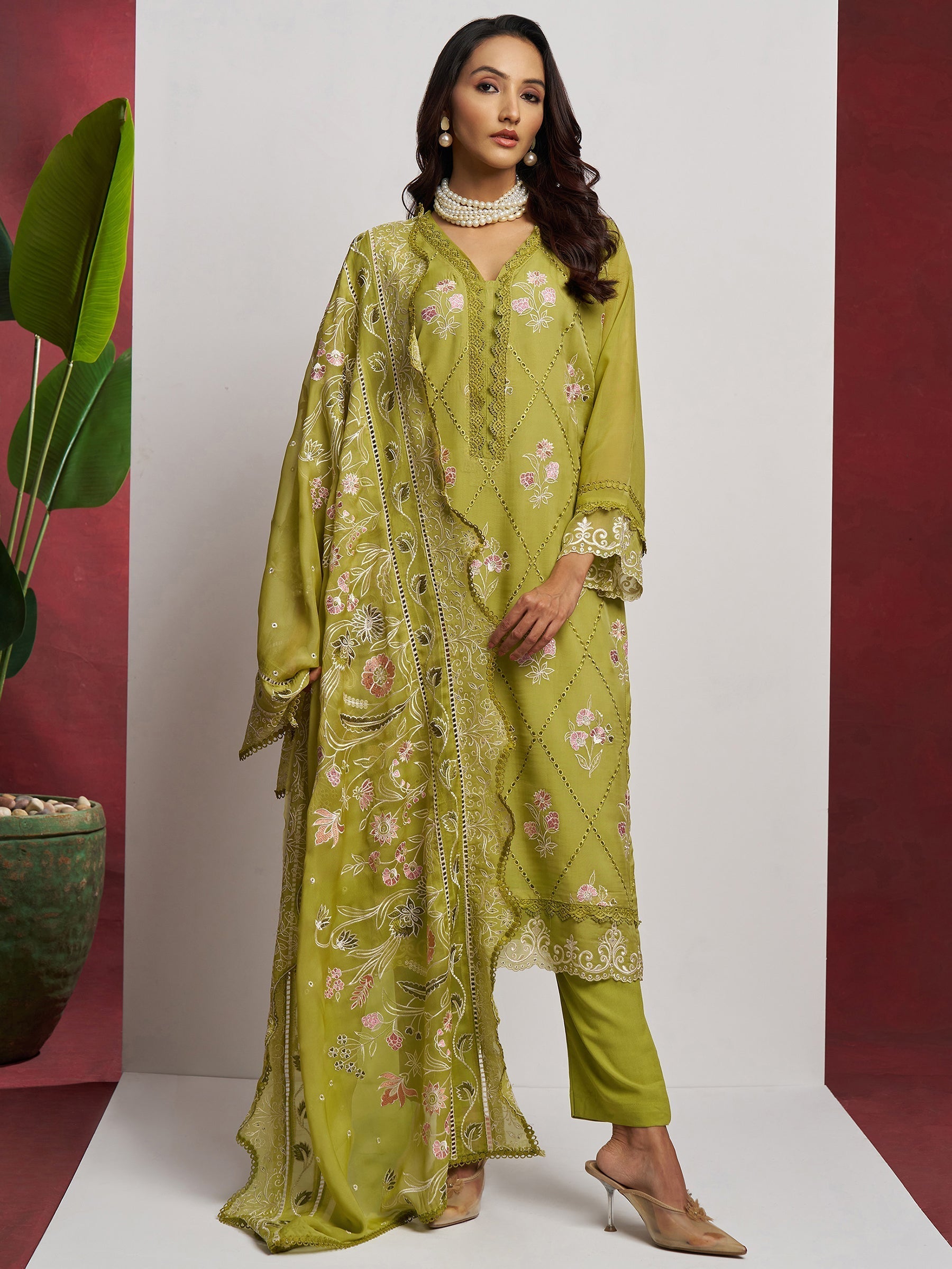 Exquisite floral embroidery and beautifully detailed lace border enhancing traditional charm