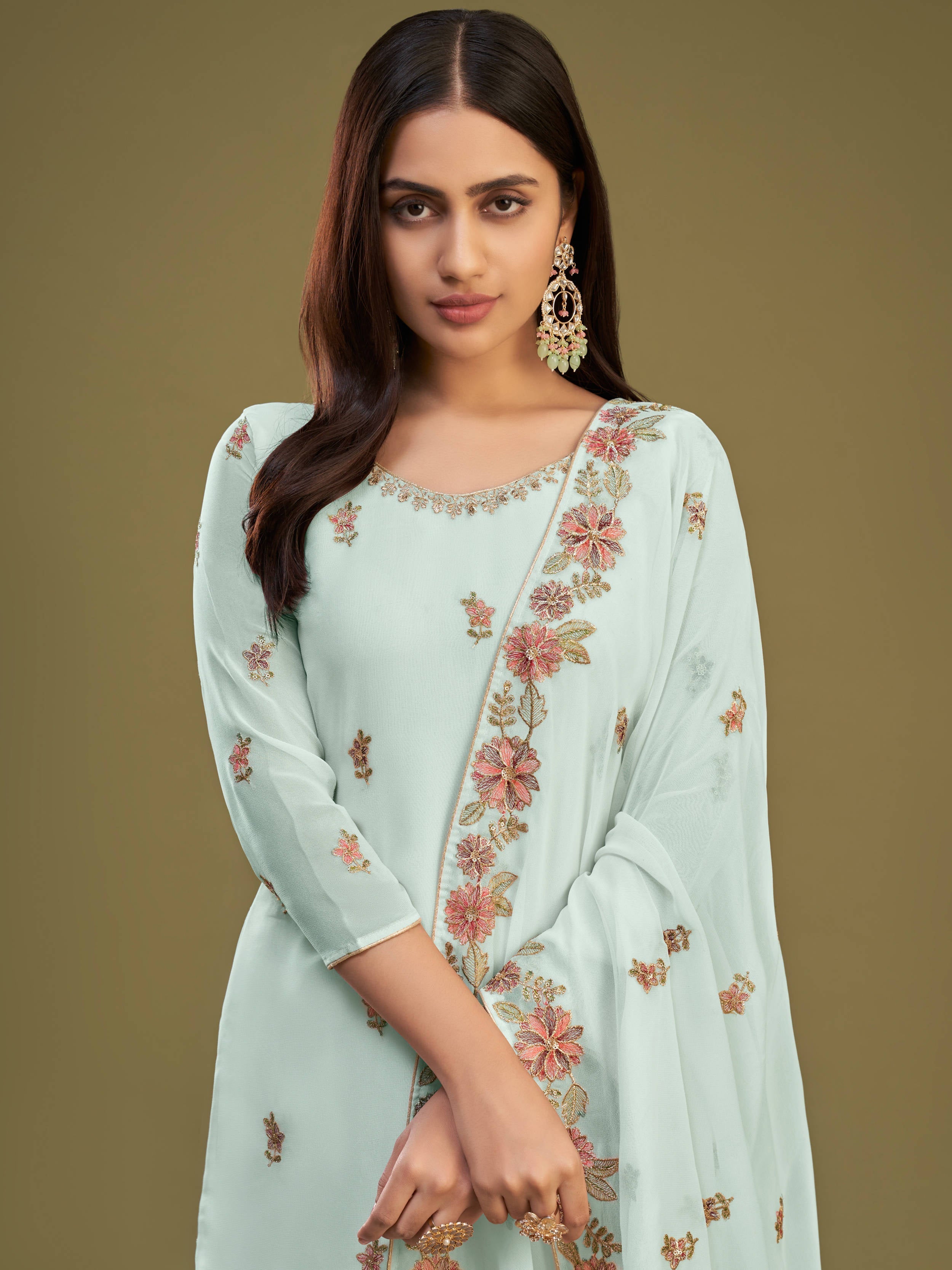 High-quality georgette material in firozi color with intricate embroidery and sequin details