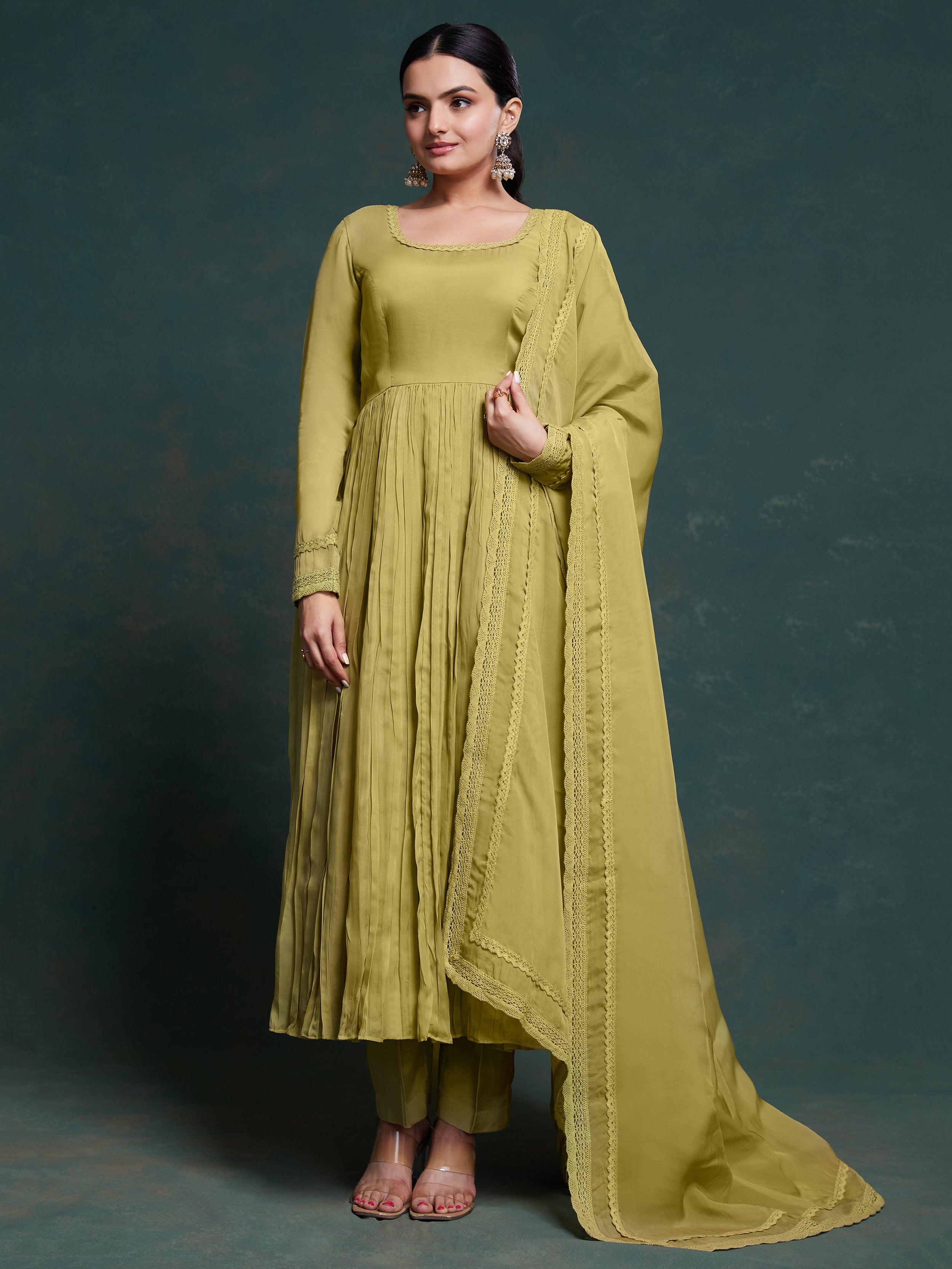 Green organza suit with intricate lace detailing