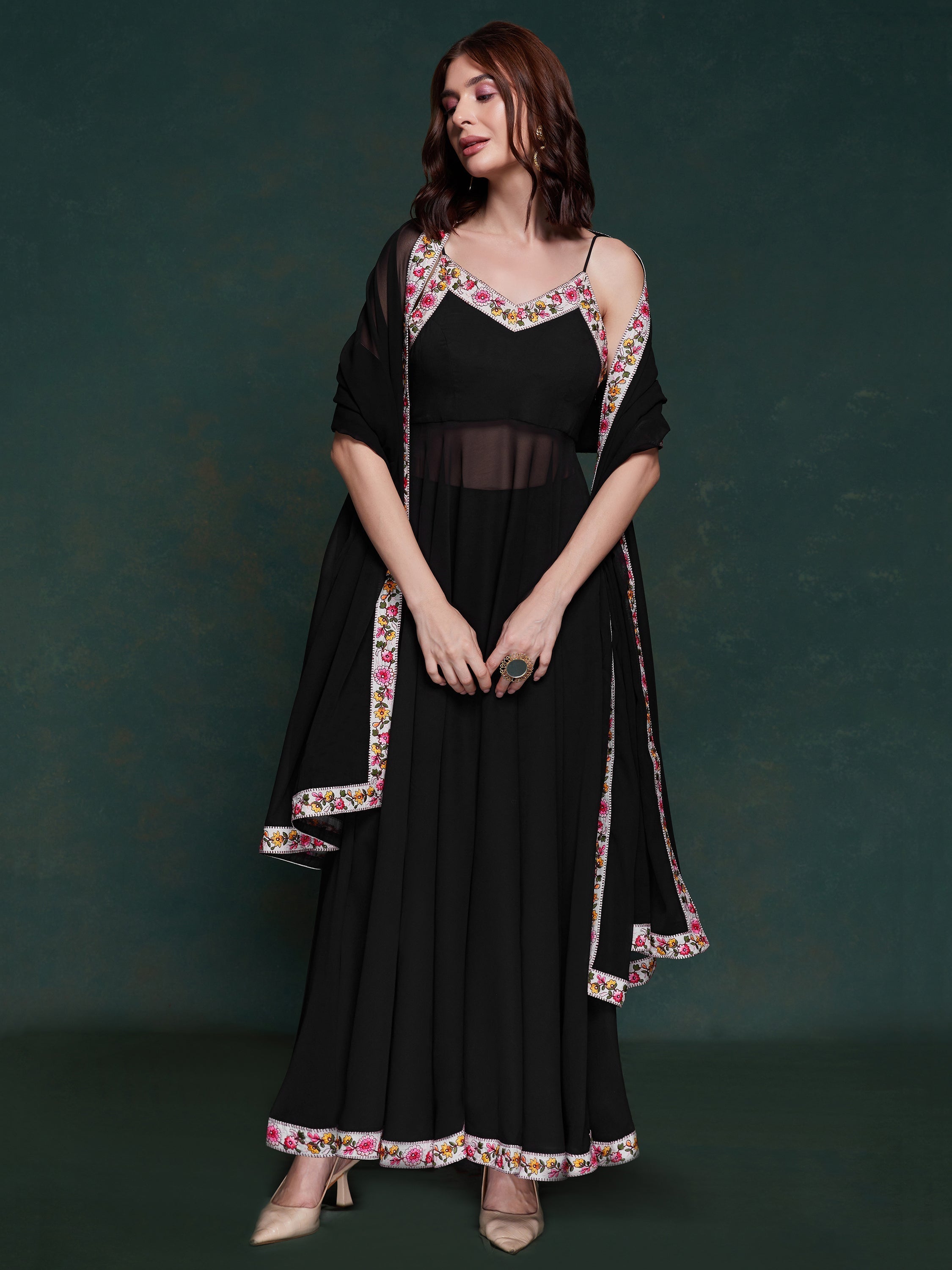 Timeless black hue and detailed lace embellishments alt text