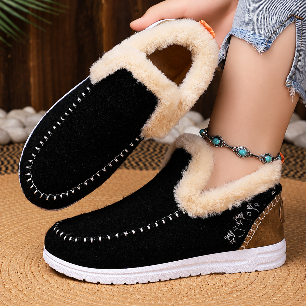 Black women's Wrenvale faux fur lined winter slip-on moccasins by Bootara, featuring round-toe design and cozy interior.