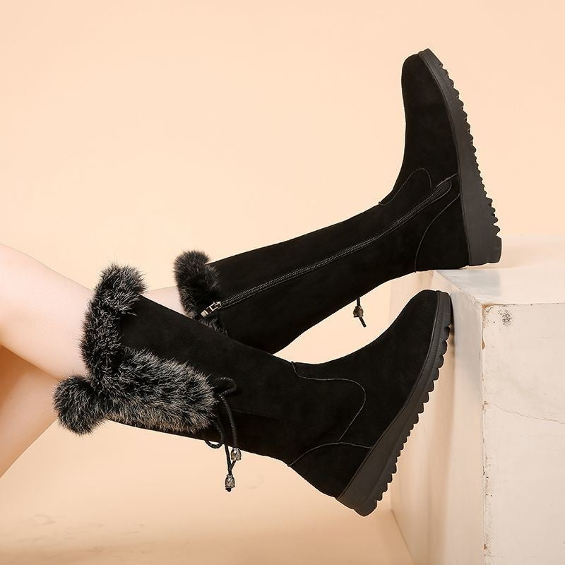 Women's black Elowick tall winter boots by Bootara with fur cuff, side zip, and wedge lug sole, available in US sizes 4 to 9.
