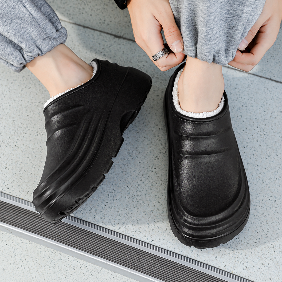Black women's Rovelle Plush Lined Clogs by Bootara with closed back and slip-on design, featuring a sculpted EVA sole.