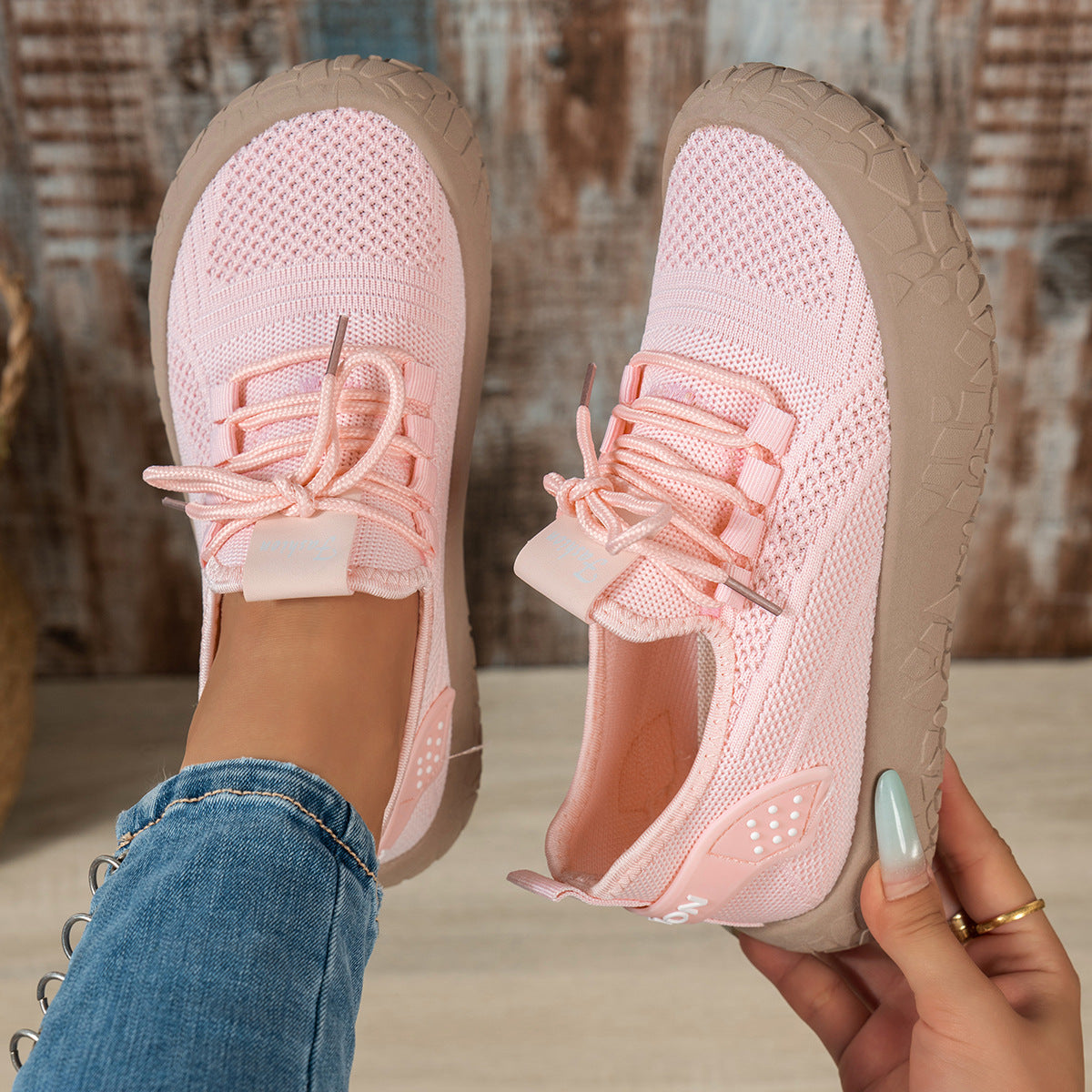 Pink women's Thessalie Knit Sneakers by Bootara featuring breathable slip-on design, laces, and textured chunky sole.