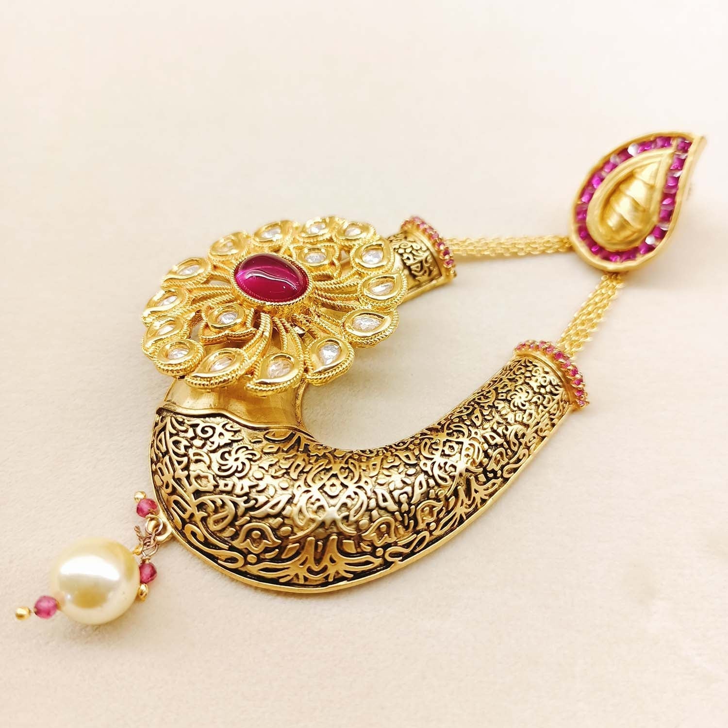 Elegant antique gold plated earrings with majenta stone
