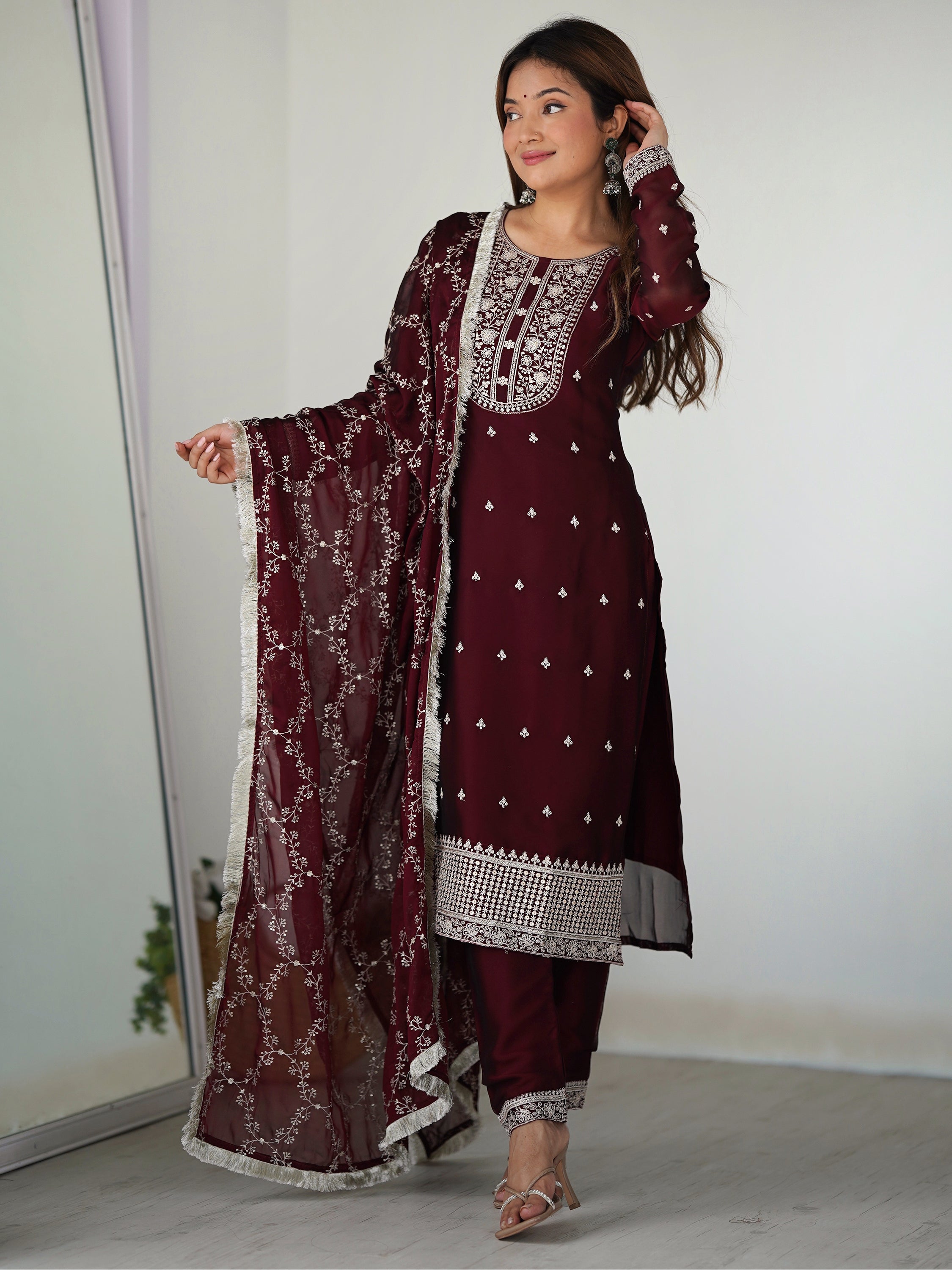Maroon silk pant suit with intricate thread work, perfect for festivals