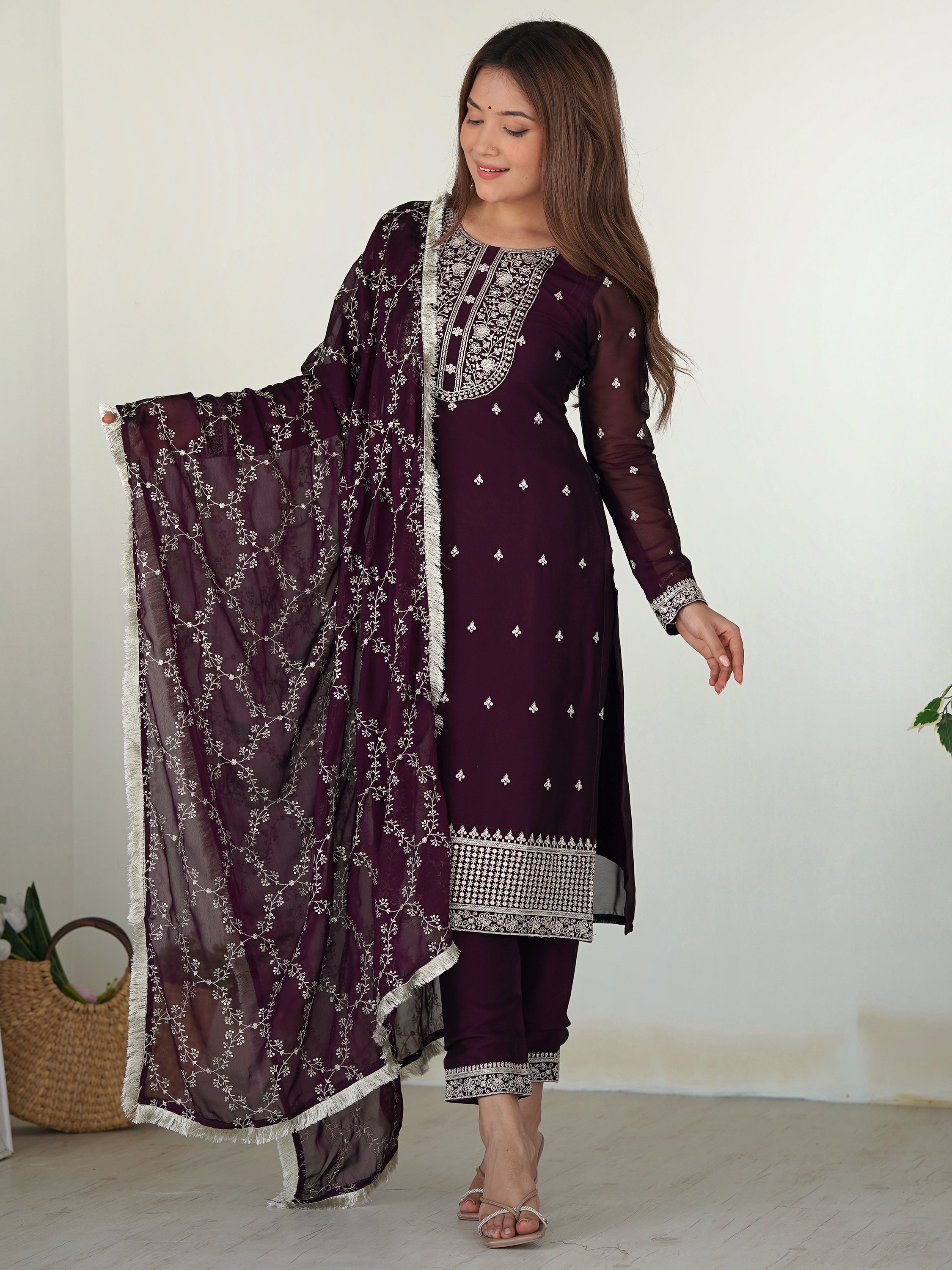 Purple silk pant suit with intricate embroidery, paired with matching dupatta