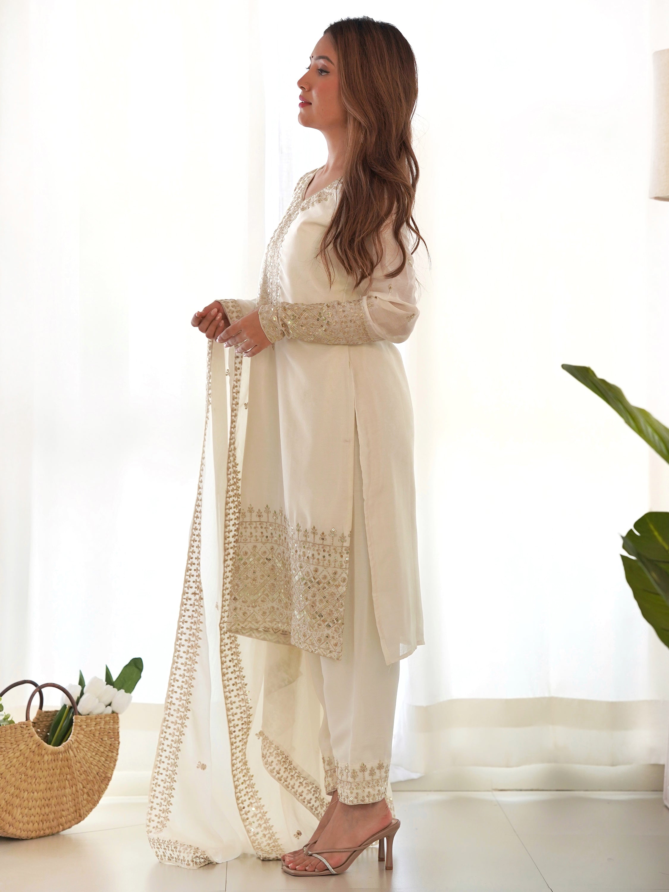 Matching bottom and dupatta adorned with similar embroidery work