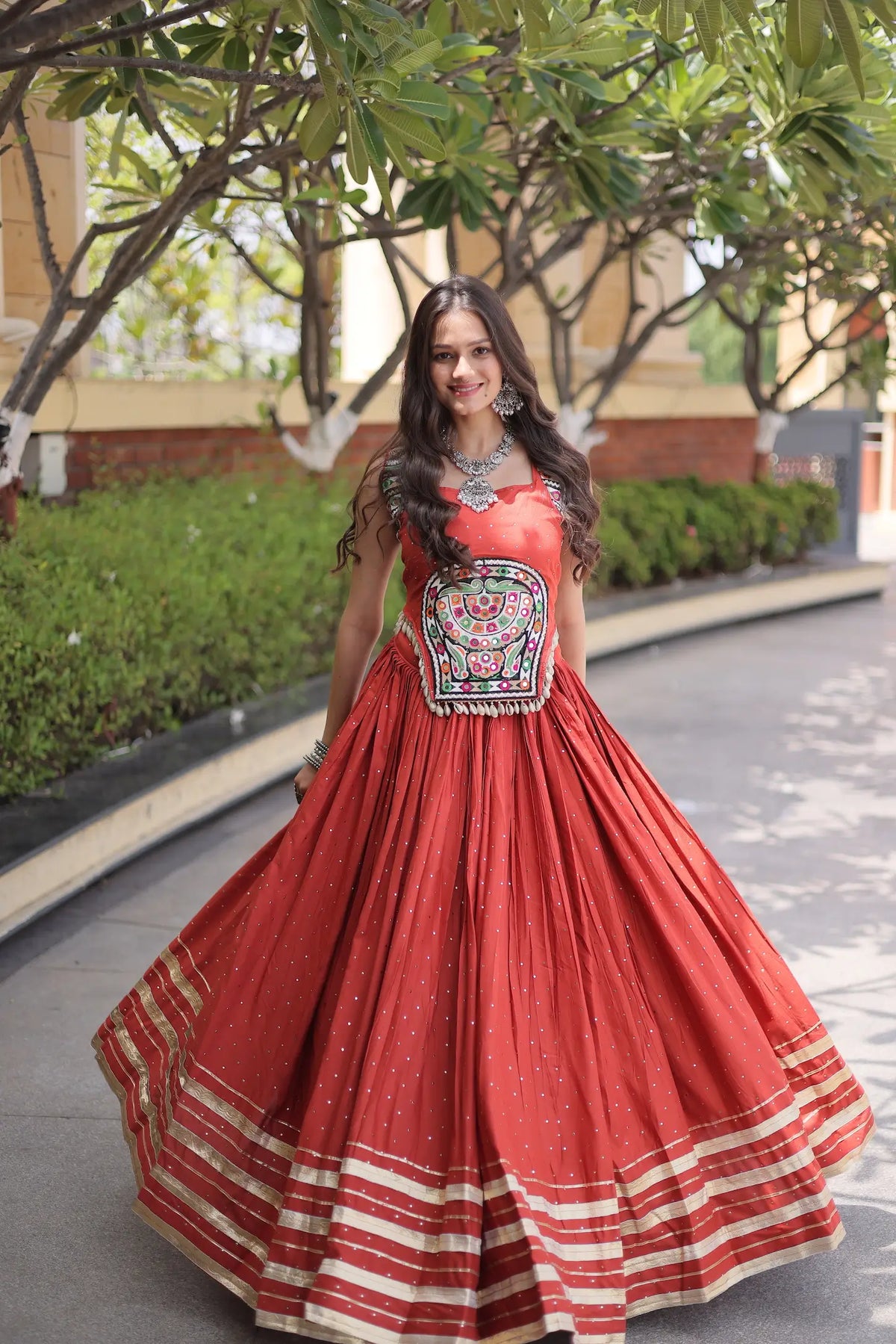 5 Meter Flair | Rust Orange Garba Chaniya Choli With Gamthi & Mirror Work