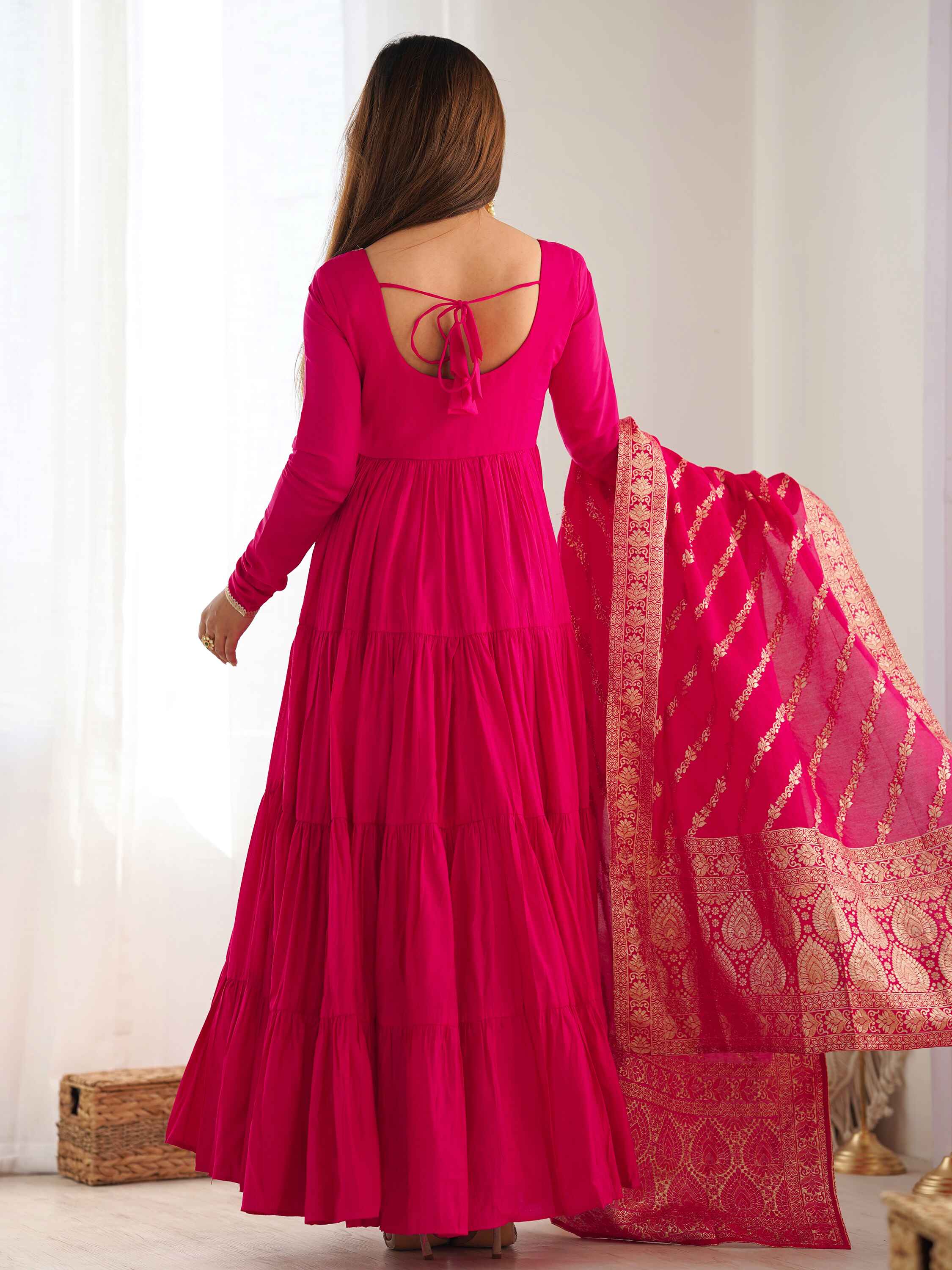 Hot pink chanderi pants perfectly complementing the anarkali's elegance
