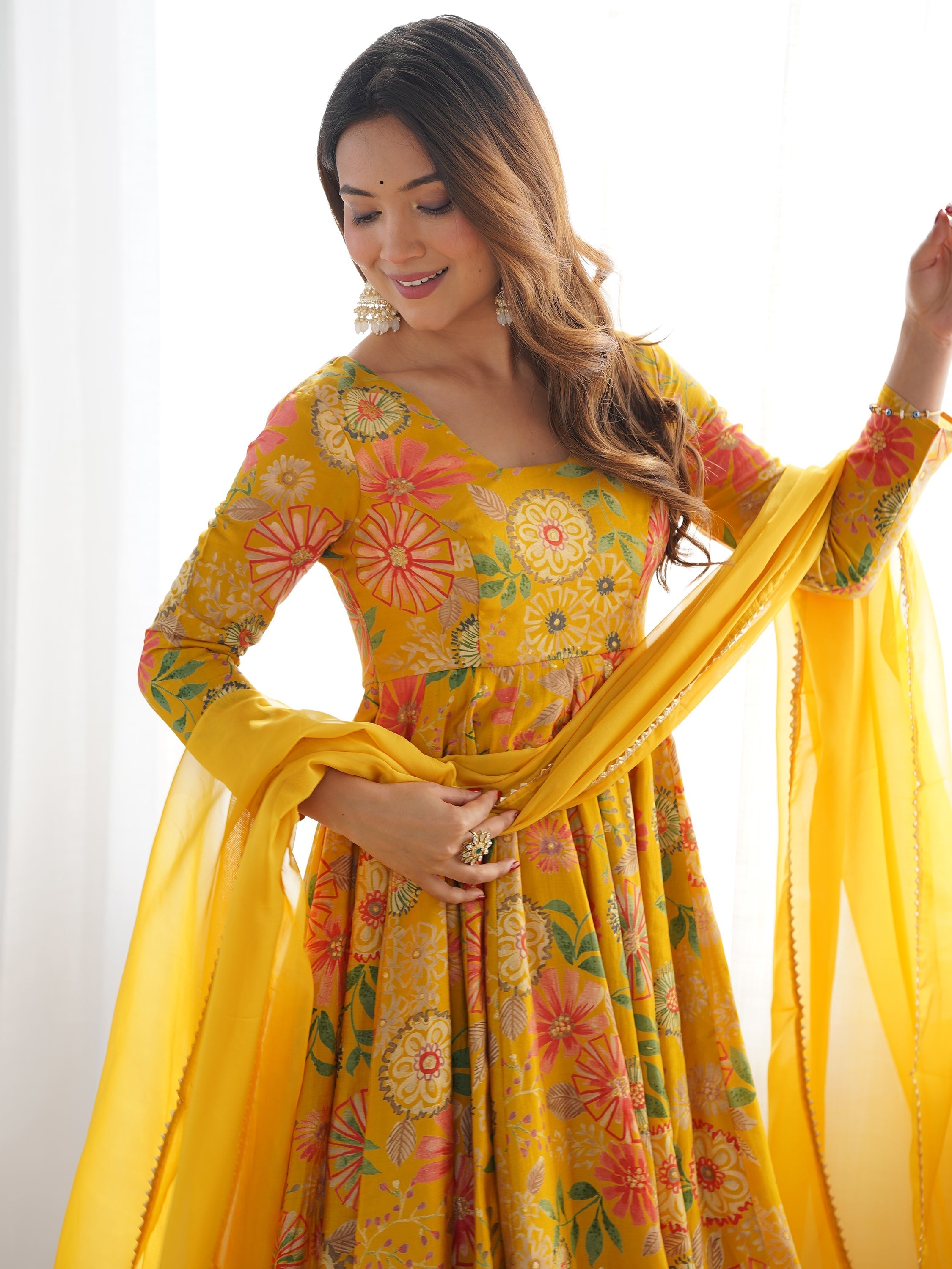 Stunning yellow anarkali suit crafted from heavy pure roman silk fabric