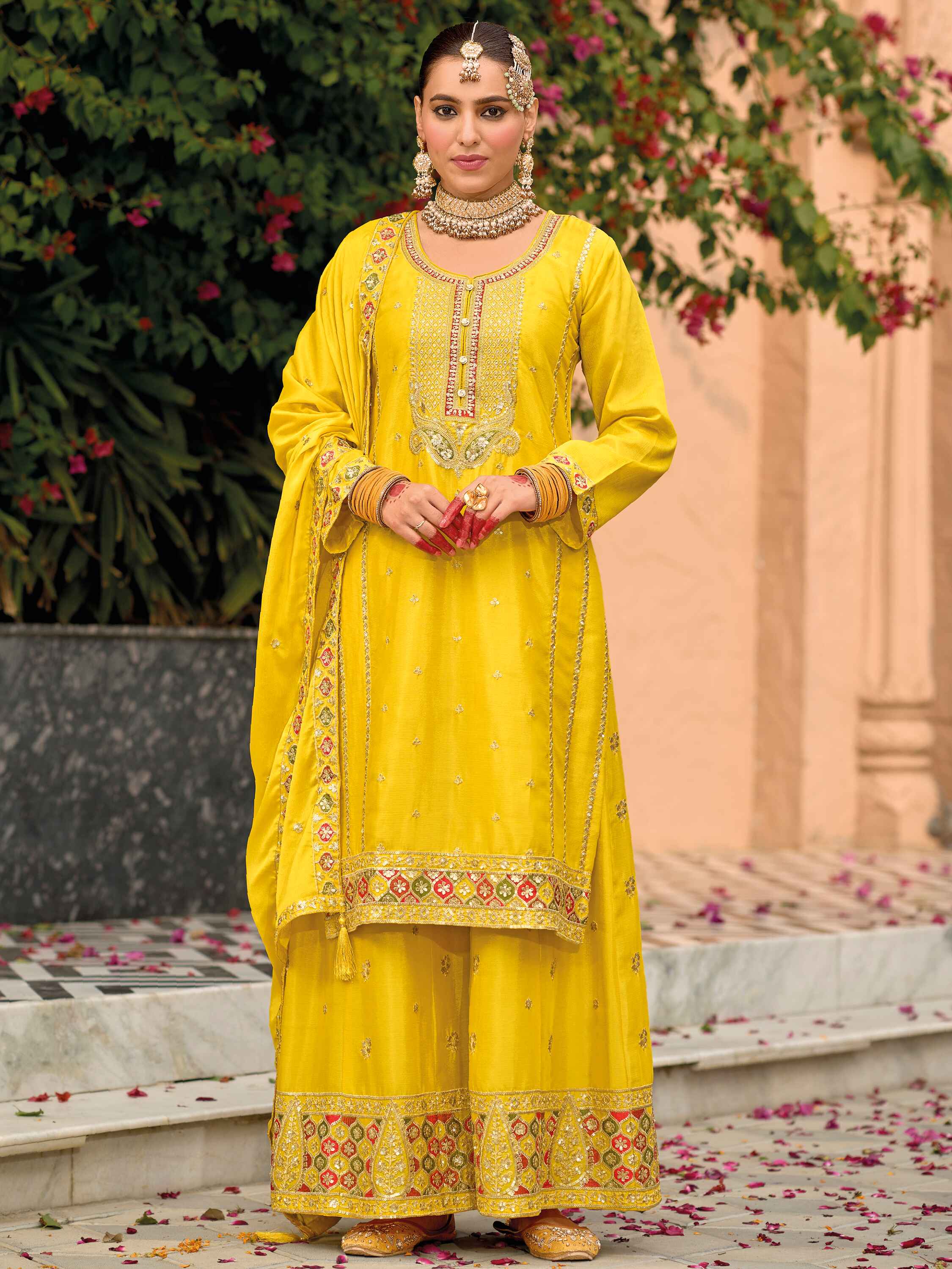 Exquisite yellow heavy chinon suit with intricate zari embroidery and sequins
