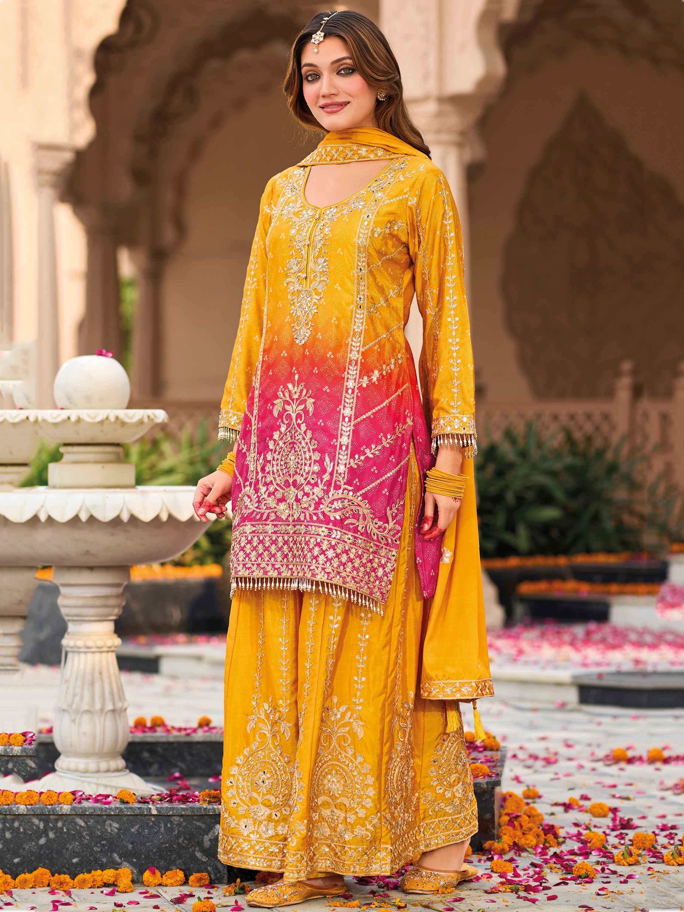 Yellow heavy chinon suit with mirror work and sequins
