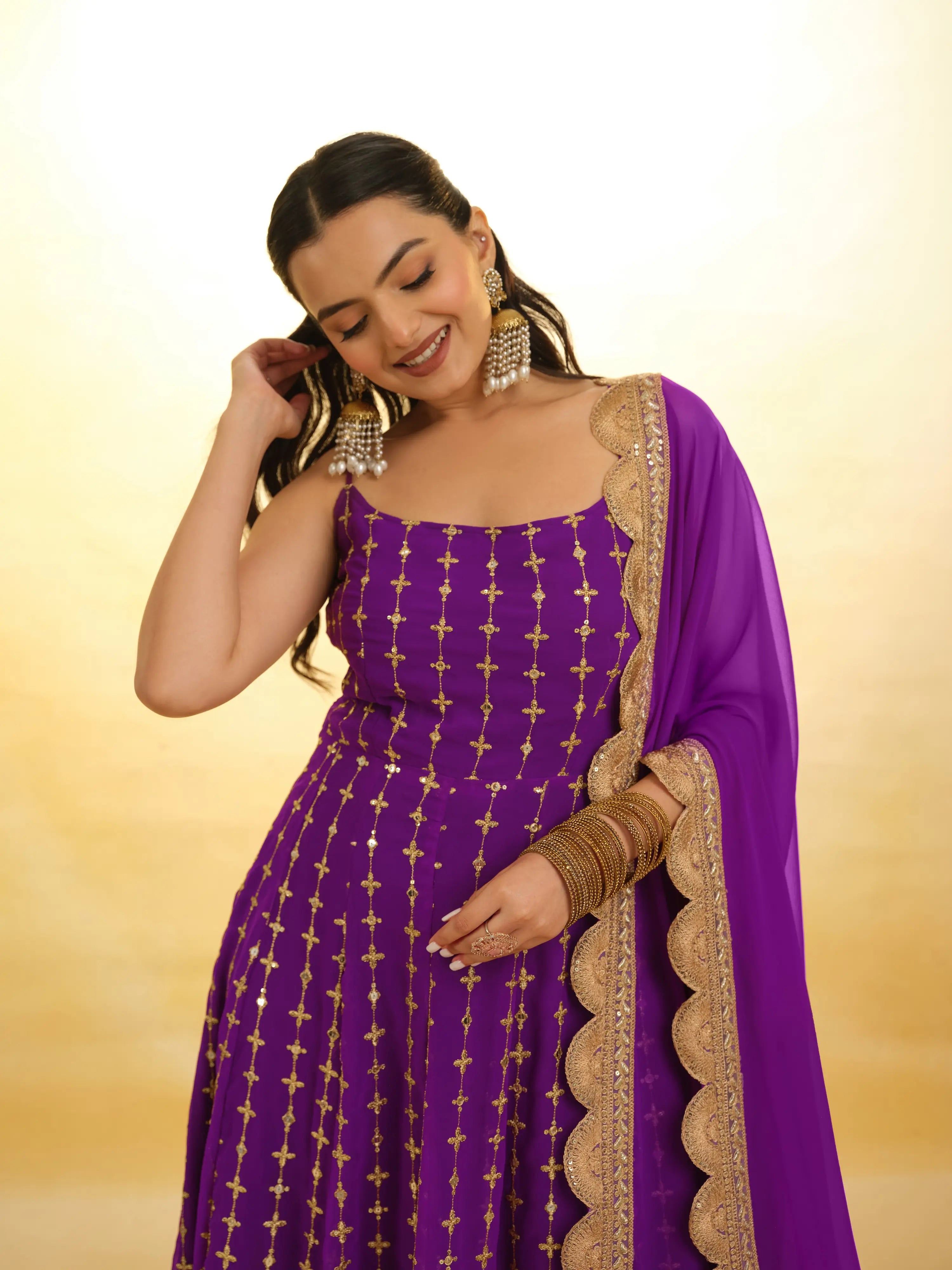 Beautiful purple embroidery salwar suit with intricate floral patterns and delicate detailing
