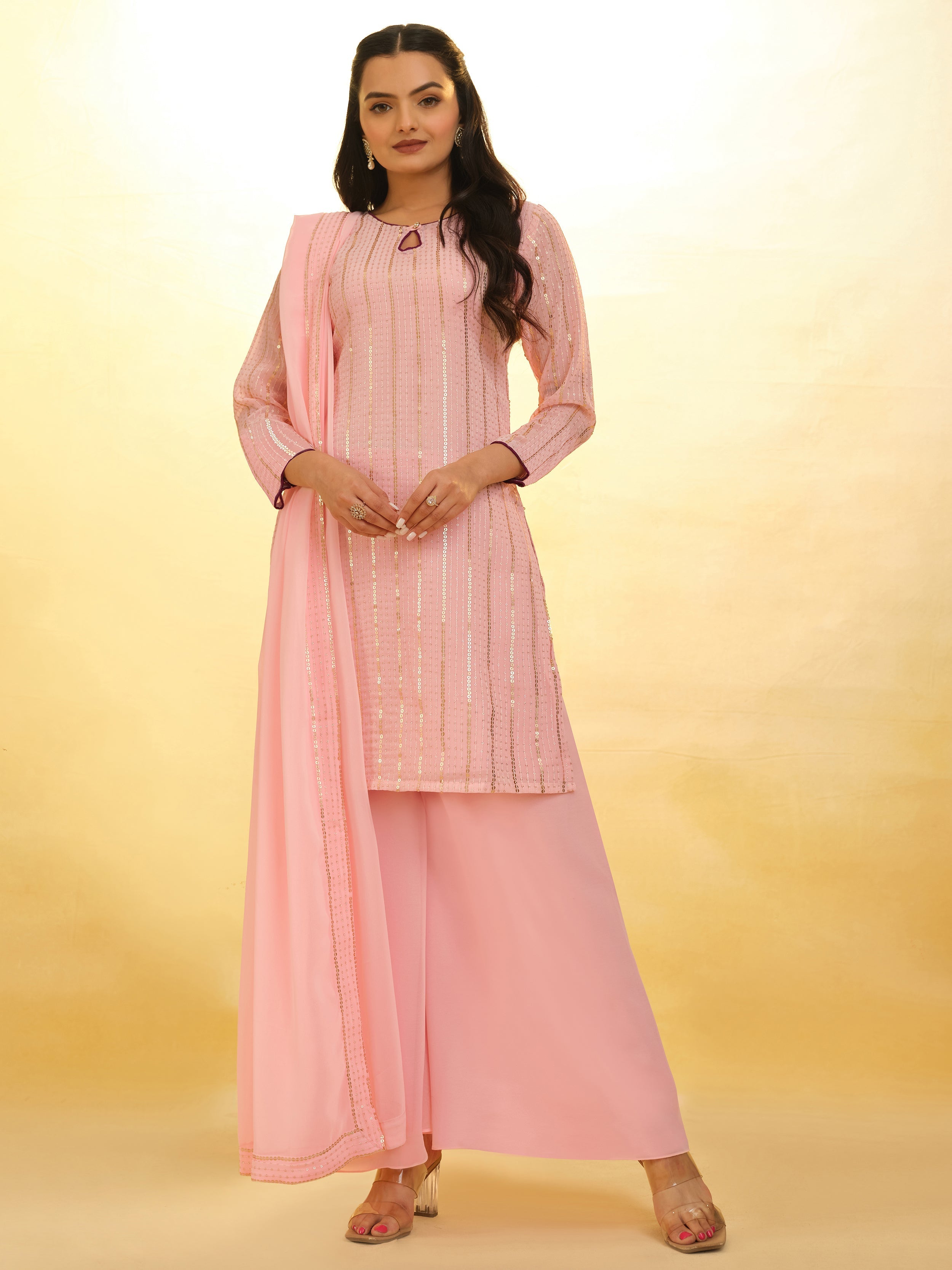 Stunning baby pink georgette suit with delicate sequin work