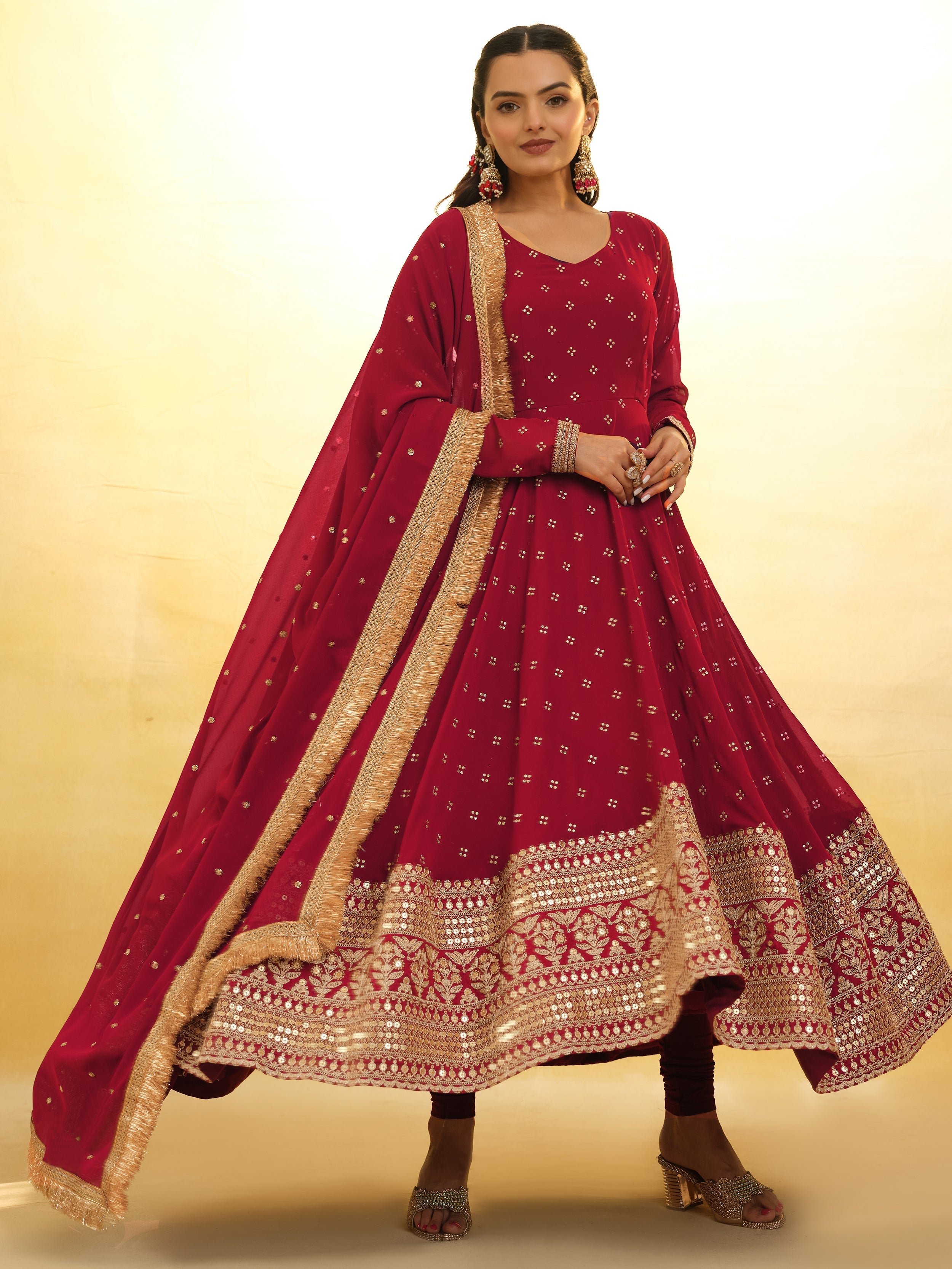 Red georgette suit with intricate embroidery and sequin detailing