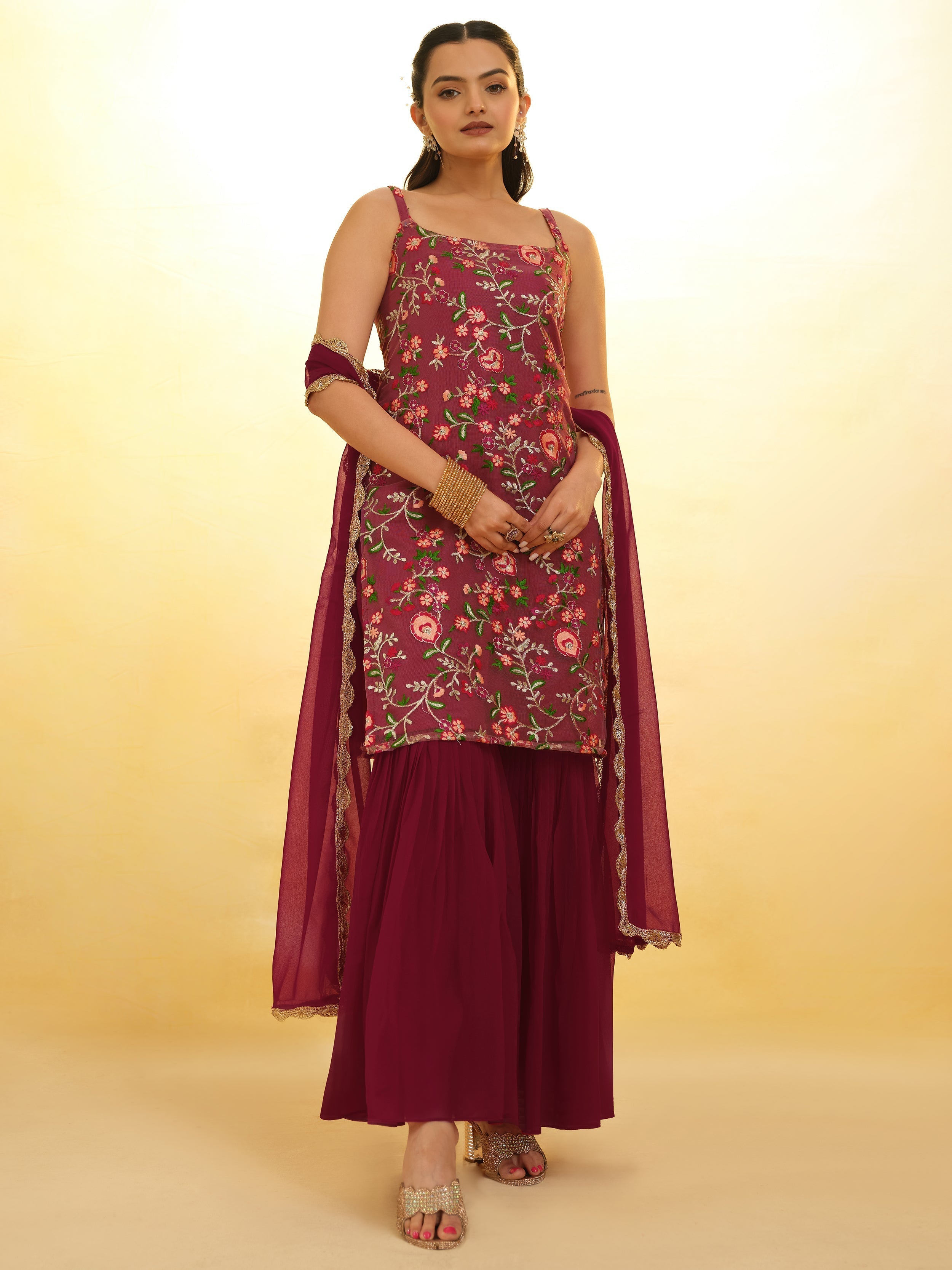 Embroidered maroon net sharara suit with intricate detailing for festivals