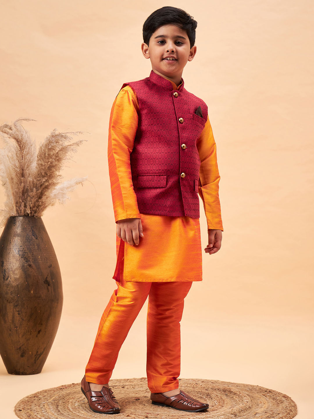 VASTRAMAY Boy's Maroon Woven Nehru Jacket With Orange Kurta And Pyjama Set - qivii