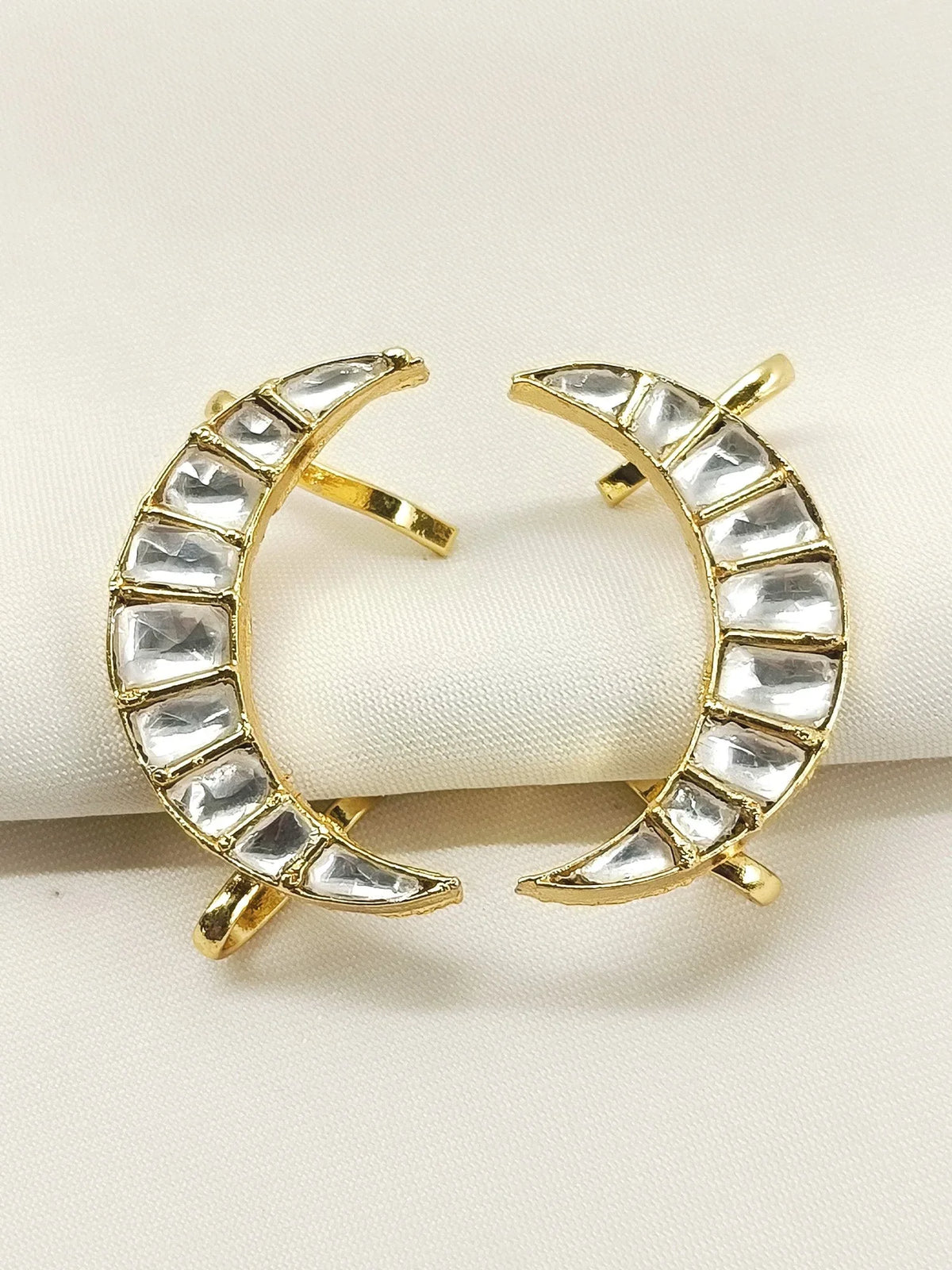 Pair of AG'S Jewelry Benu White men's moon shape Kundan earcuffs with white gold plating, featuring intricate Kundan detailing.