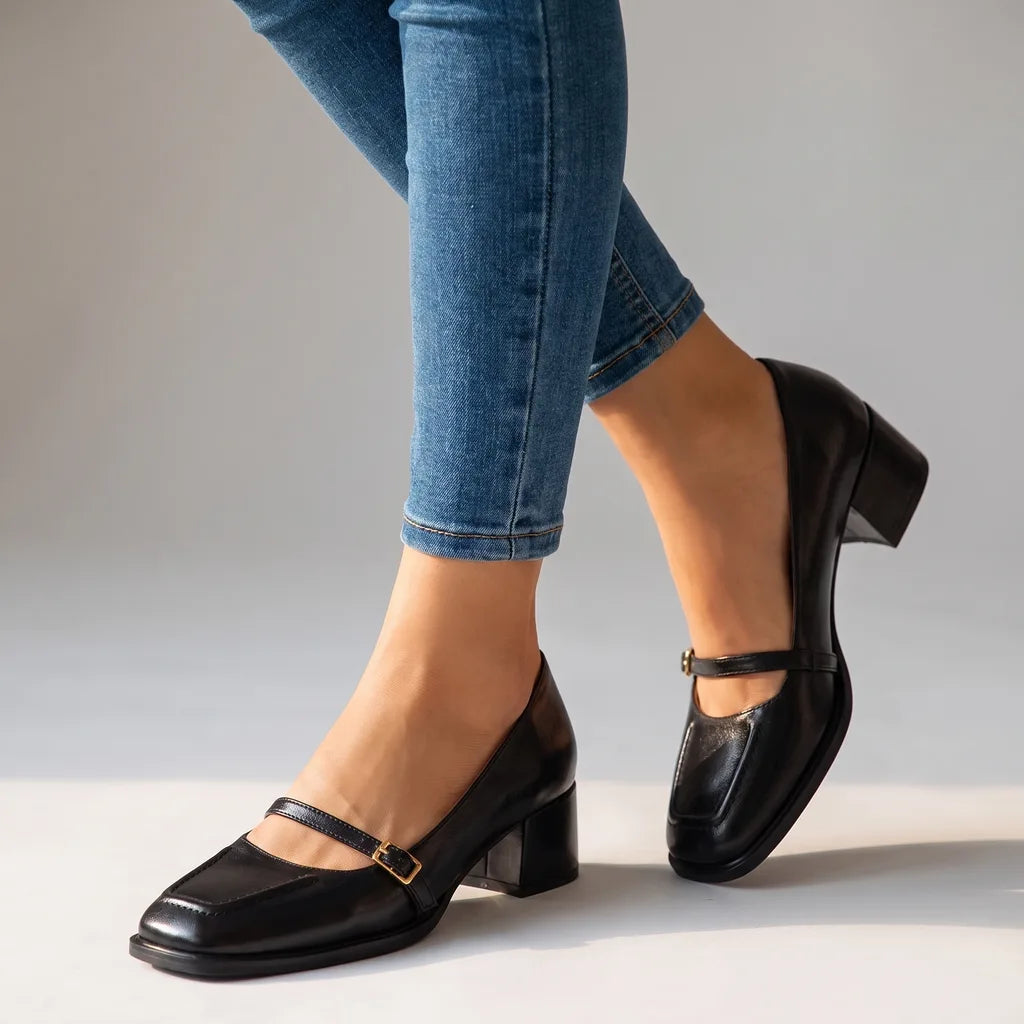 Black women's orthopedic patent Mary Jane shoes by Qivii featuring low heels and comfortable fit from Hudson Ridge.