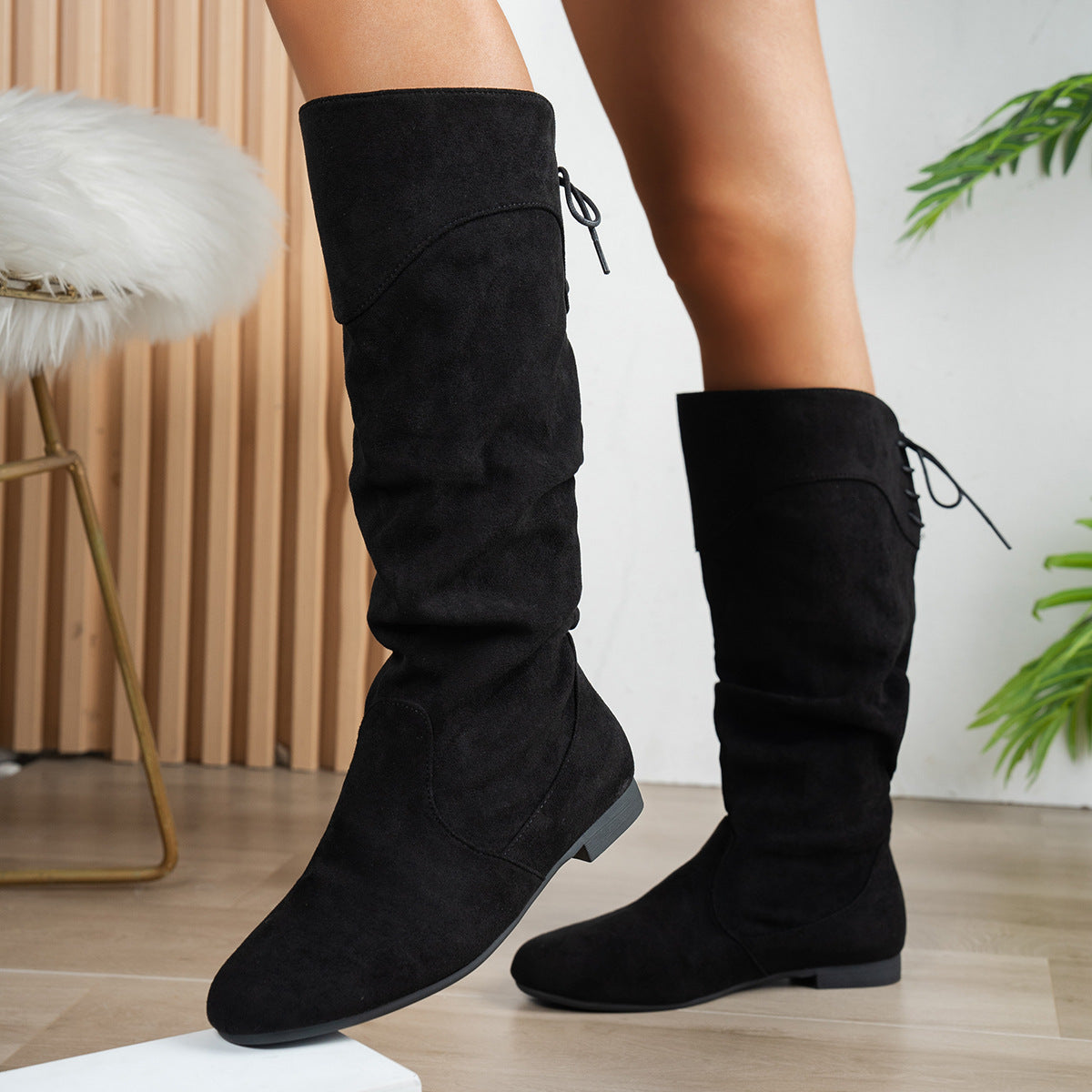 Black women's Roslyn slouch boots by Bootara with suede-look finish, back ties, low block heel, tall design, available in US sizes 5-10.5.