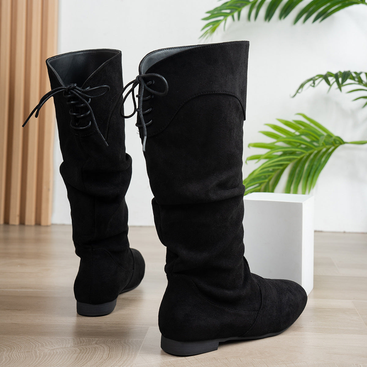 Women's Roslyn Slouch Boots by Bootara in black suede-look with back ties and low block heel, available in US sizes 5 to 10.5.