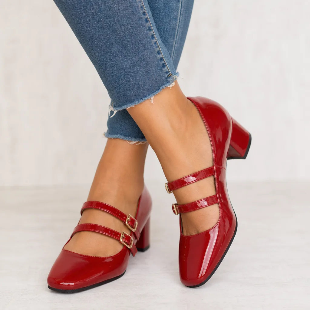 Red patent leather women's Mary Jane shoes by Hudson Ridge, featuring a classic heel and strap detail.