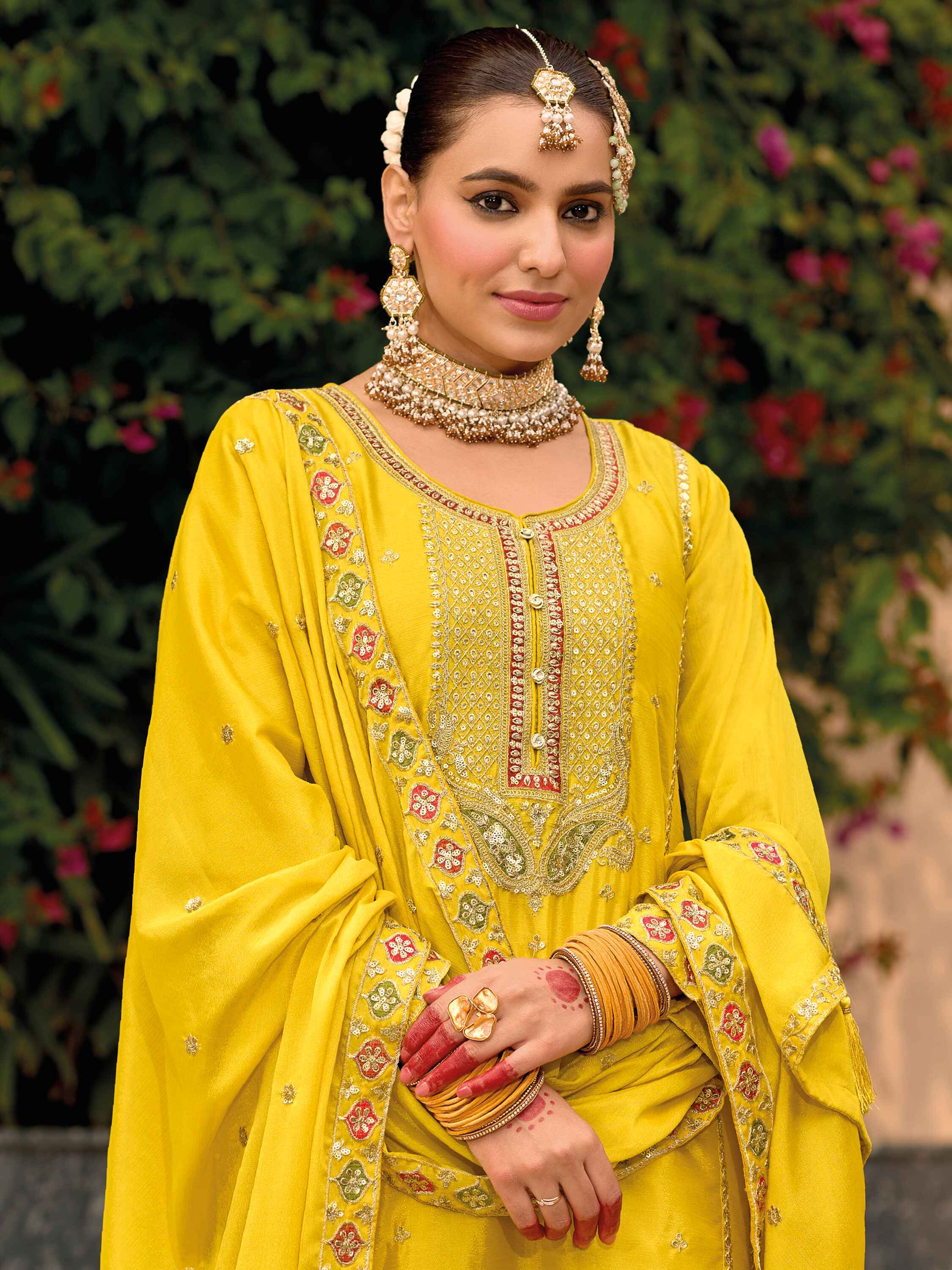 Yellow palazzo pants with detailed embroidery on front and back