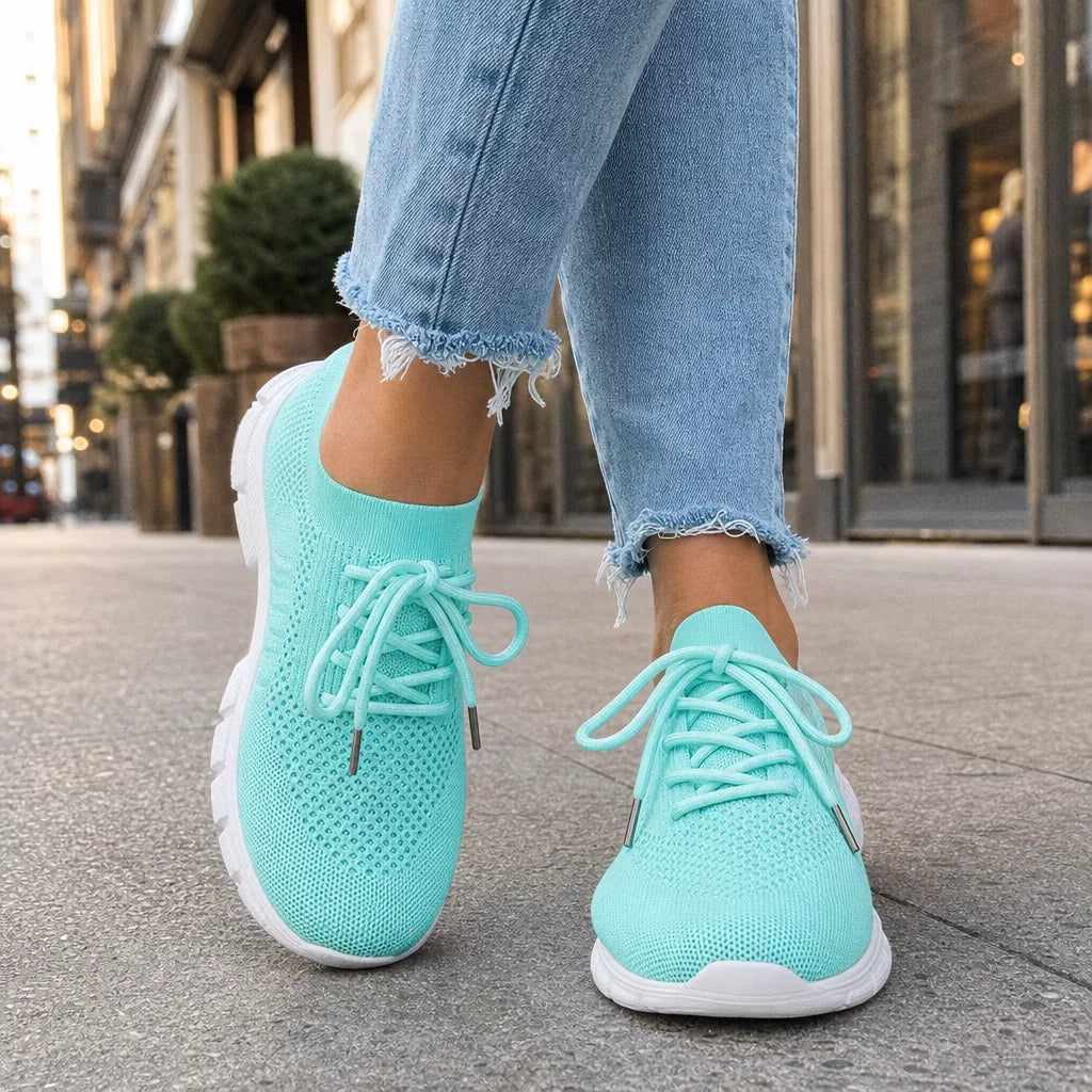 Green women's orthopedic walking sneakers by Qivii, designed for comfort and support, with a casual athletic style.